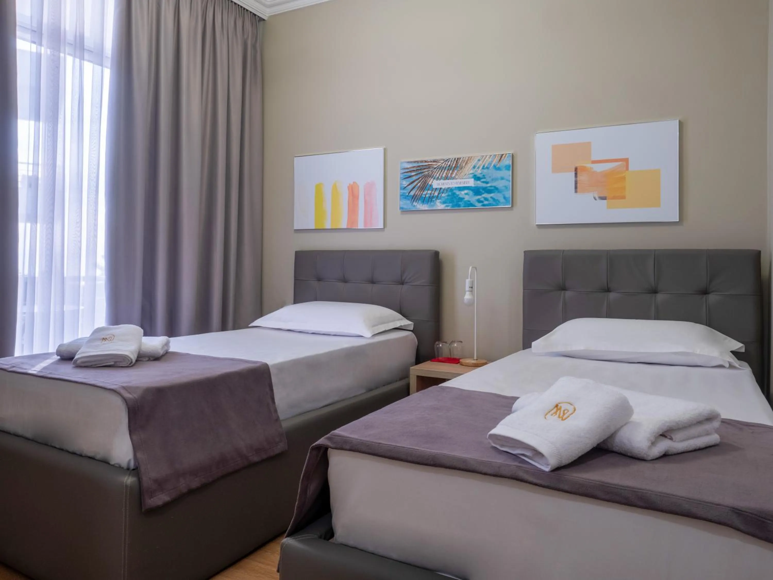 Bed in Nia Boutique Hotel by Rapo's Resort