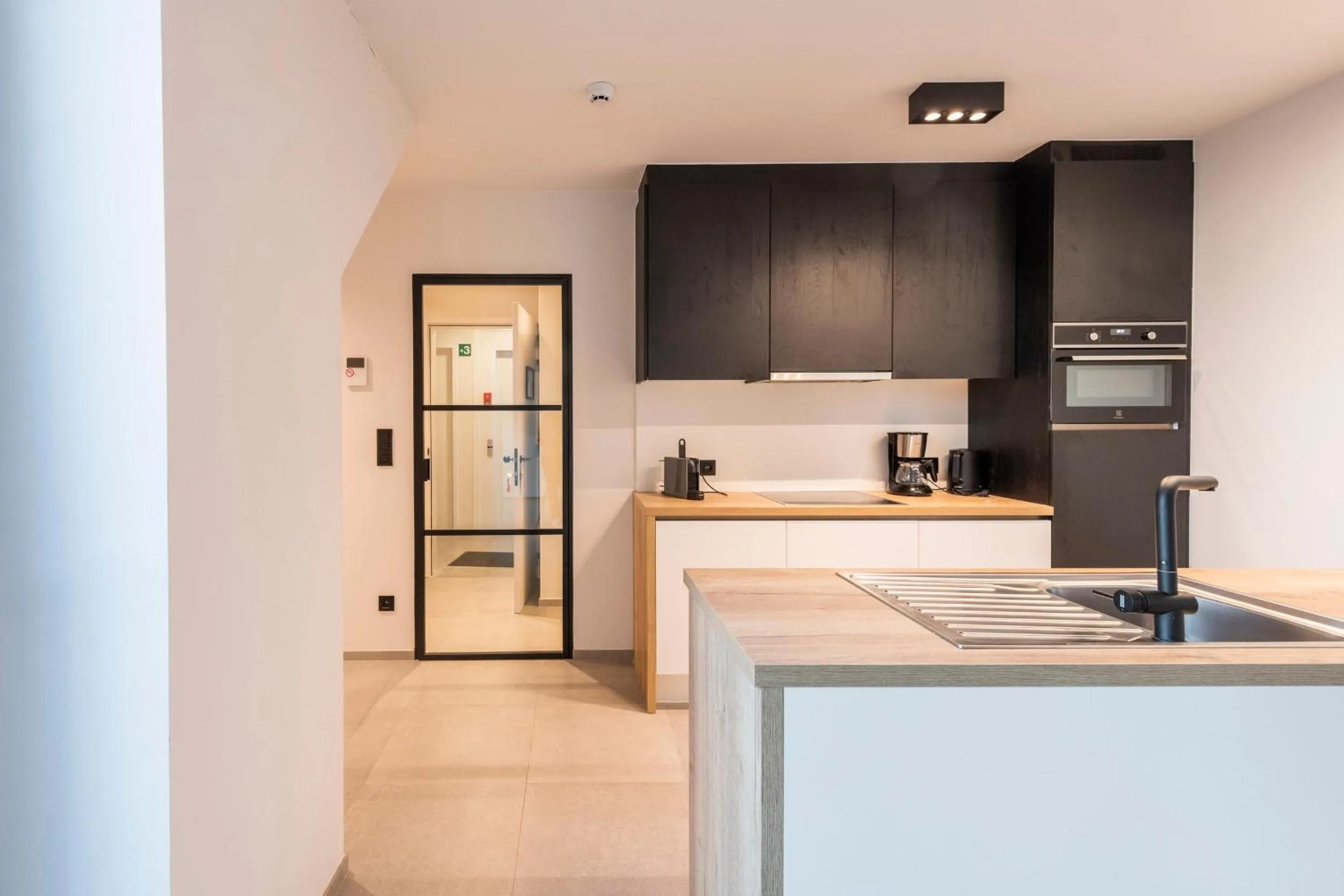 kitchen in Belcasa Beach Suites & Lofts Aparthotel