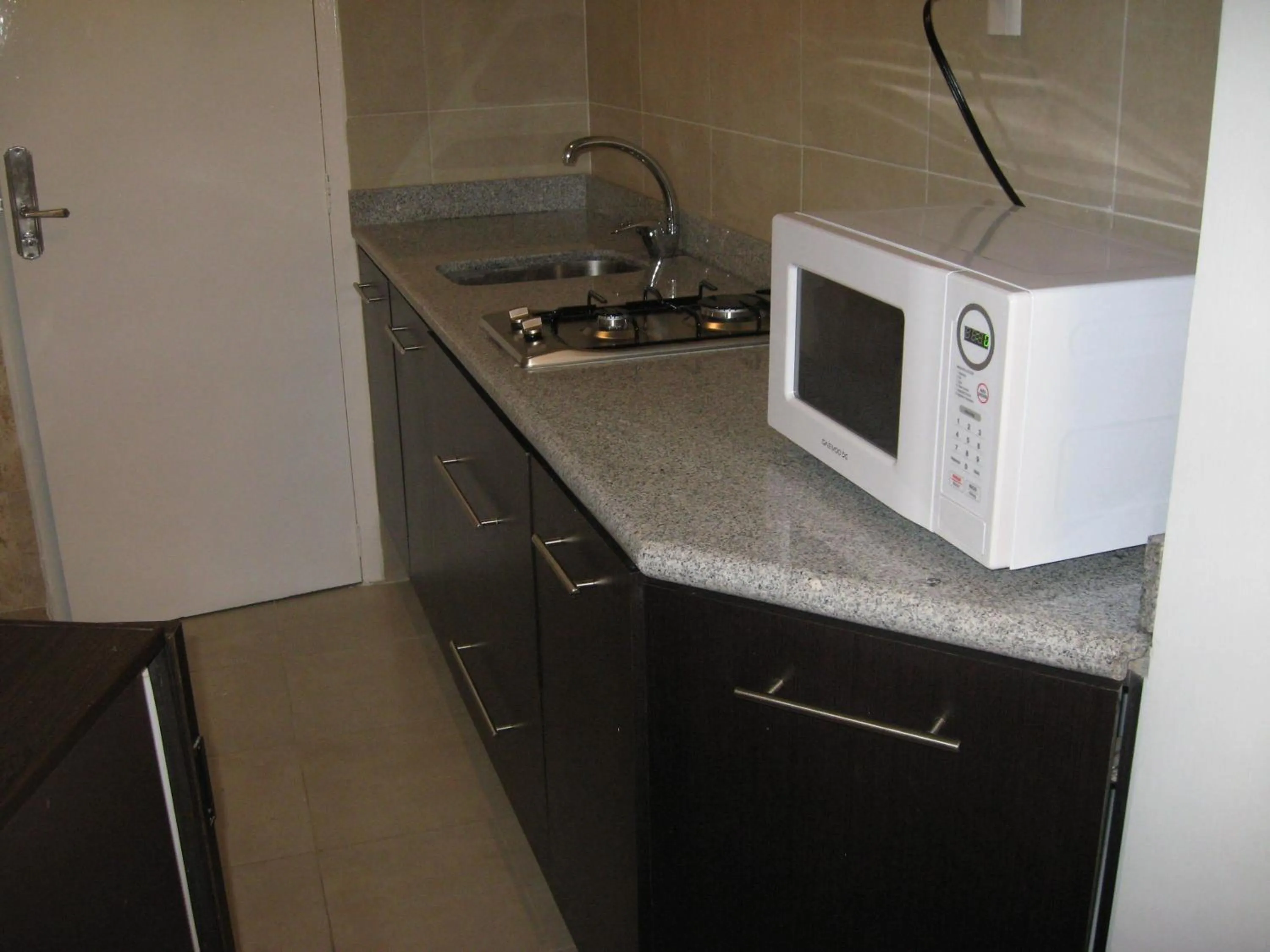 Kitchen or kitchenette in Suites Havre