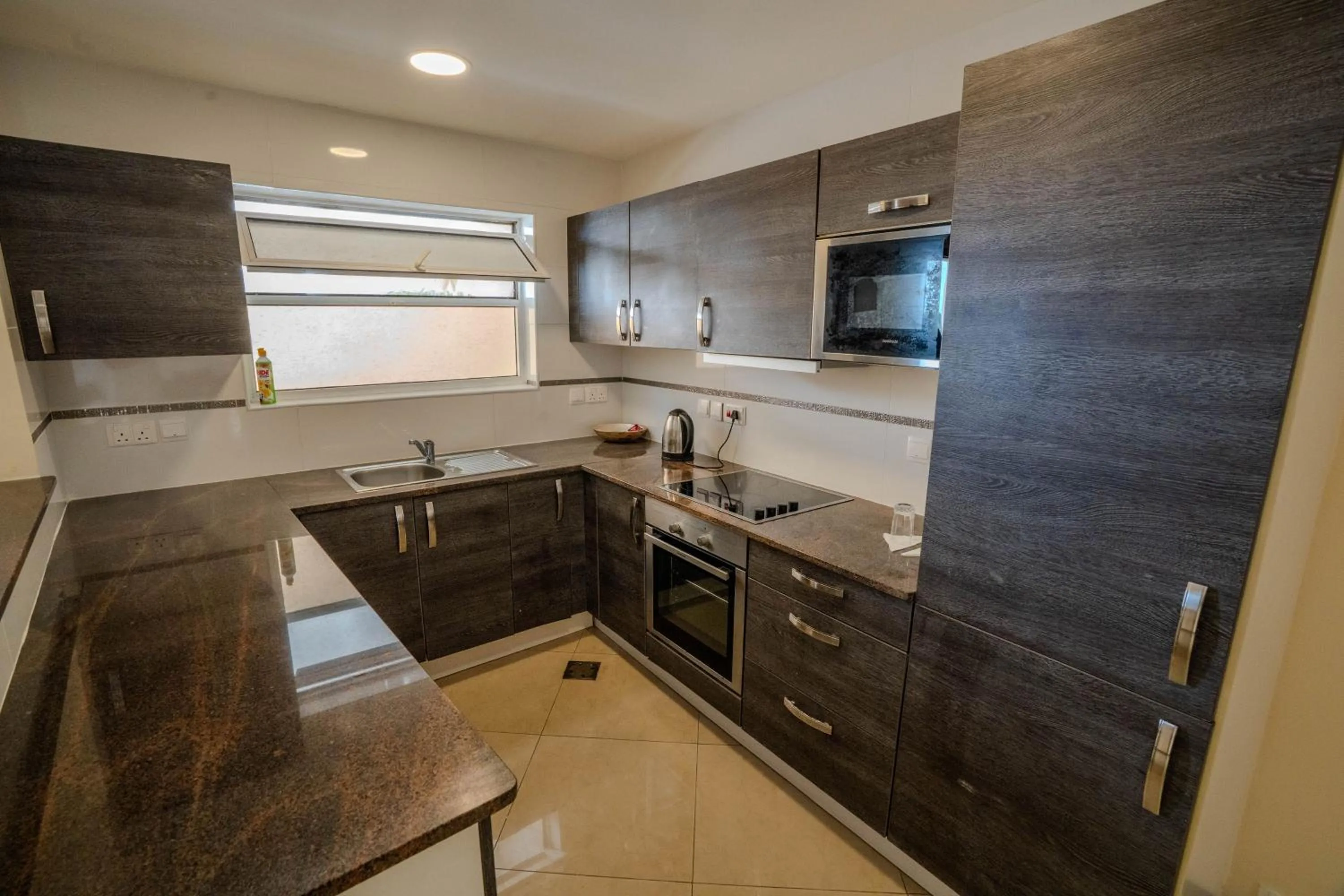 Kitchen or kitchenette in Kilua Residences by CityBlue, Mombasa