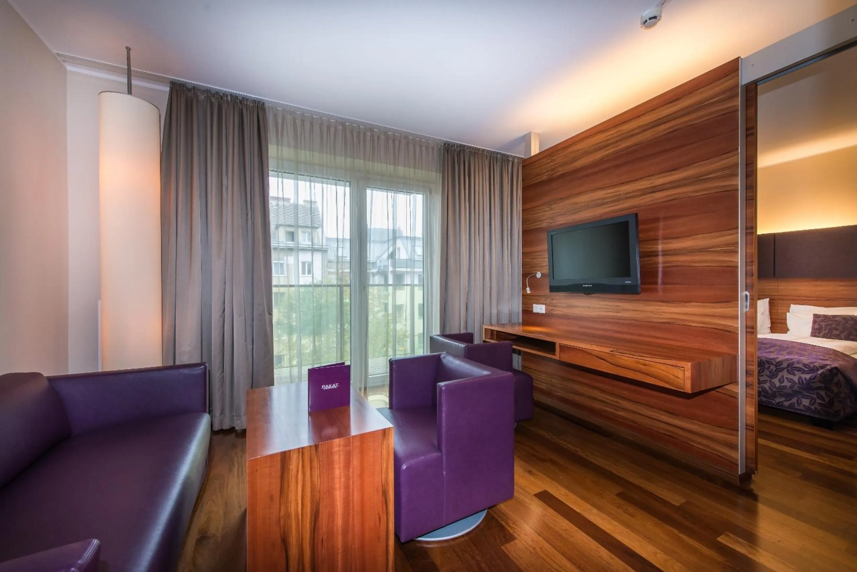 Seating area, Bed in Pakat Suites