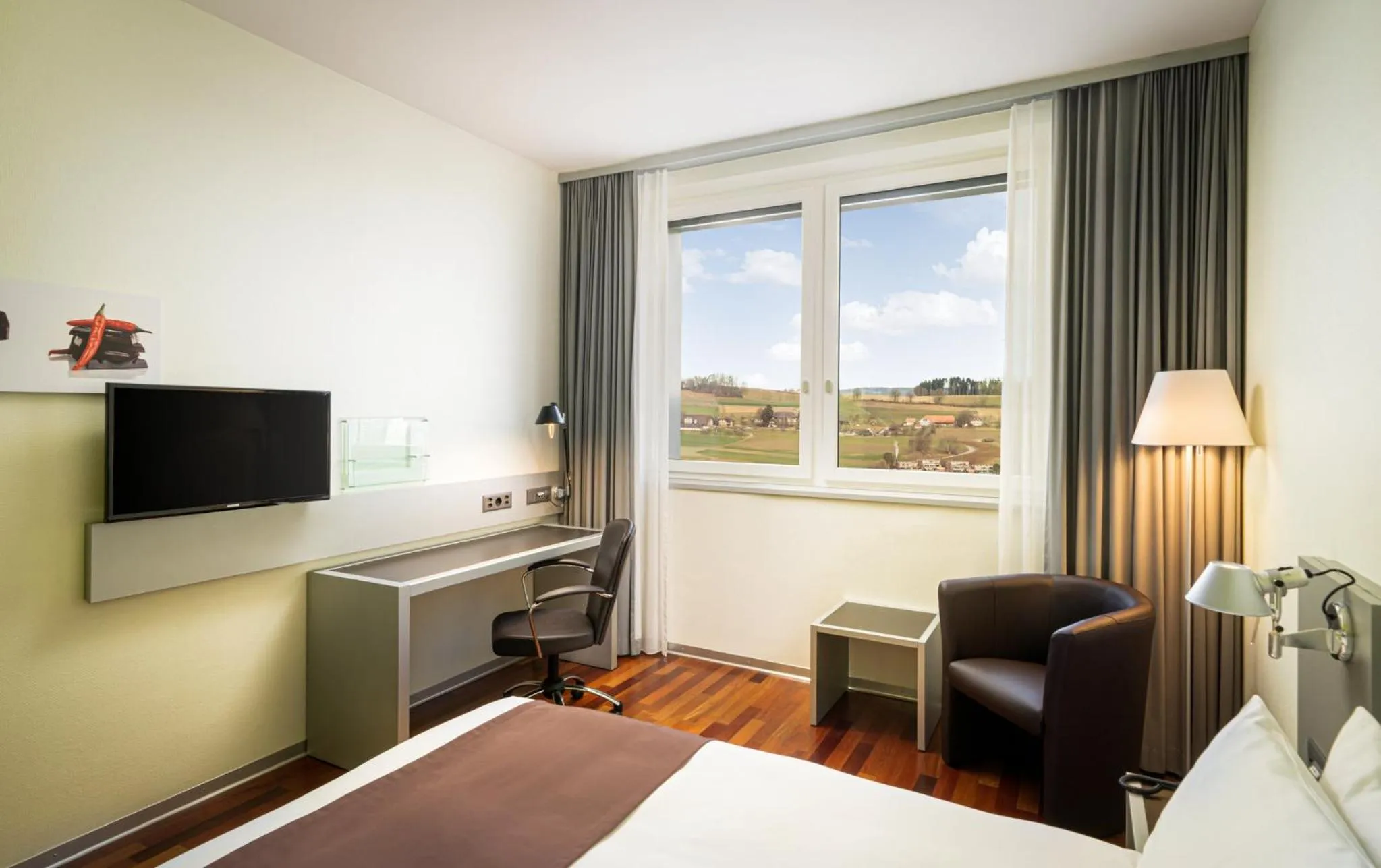 Photo of the whole room, Bed in Holiday Inn Bern Westside by IHG