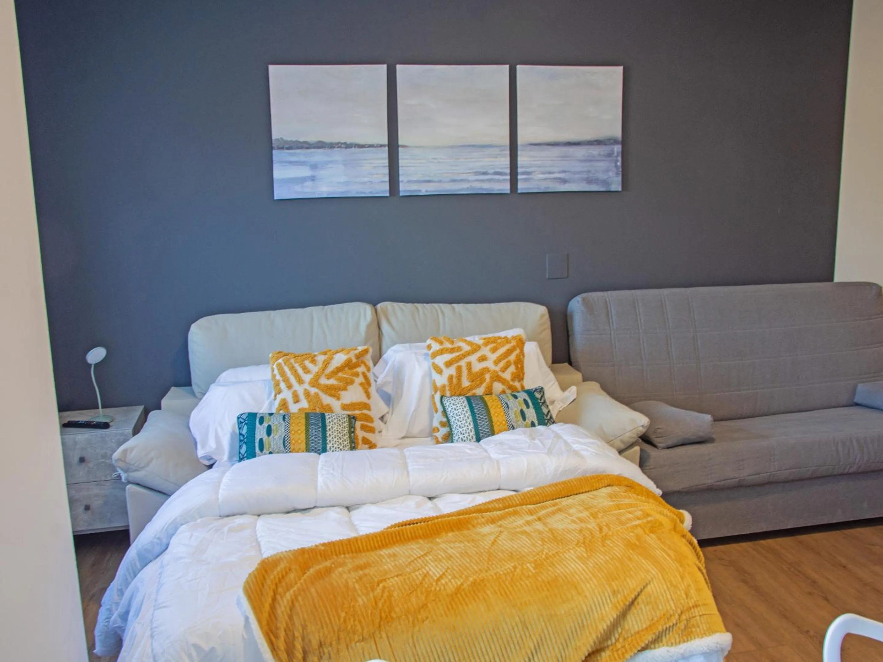 Living room, Bed in Apartamentos Santander Maliaño Suites 3000