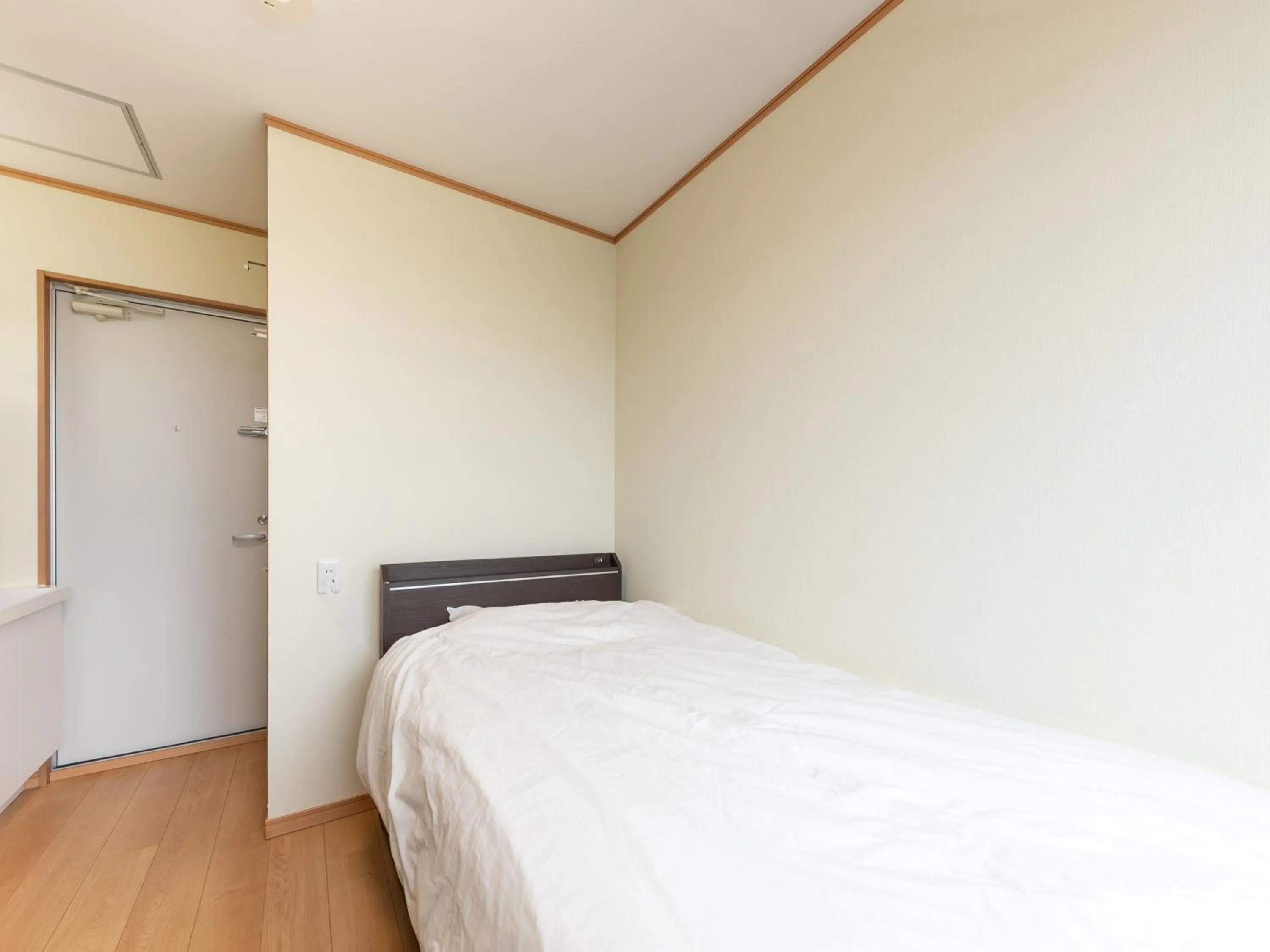 Bed in Tabist Hotel Takagiya Iwaki