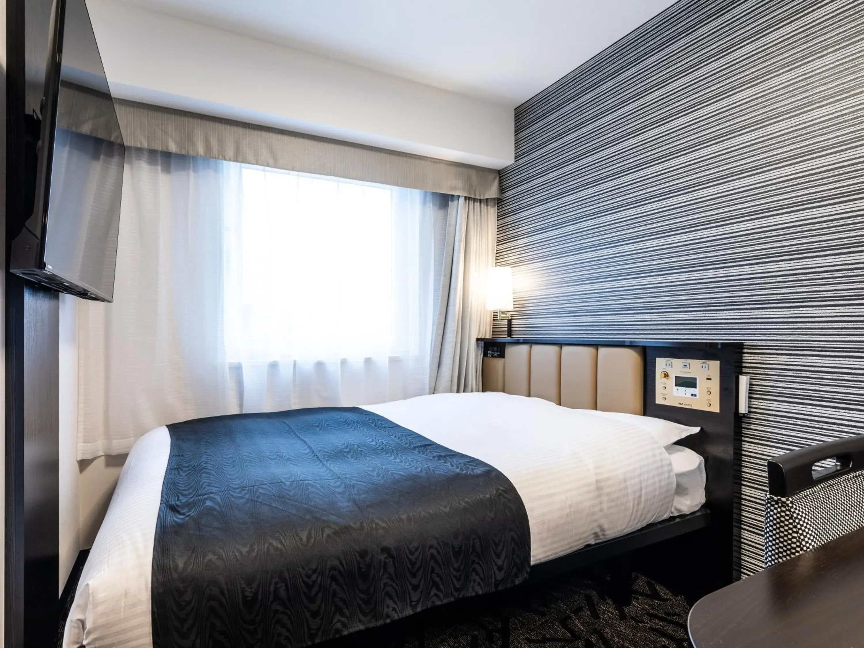 Bed in APA Hotel Kintetsu-Nara Ekimae Bed in APA Hotel Kintetsu-Nara Ekimae