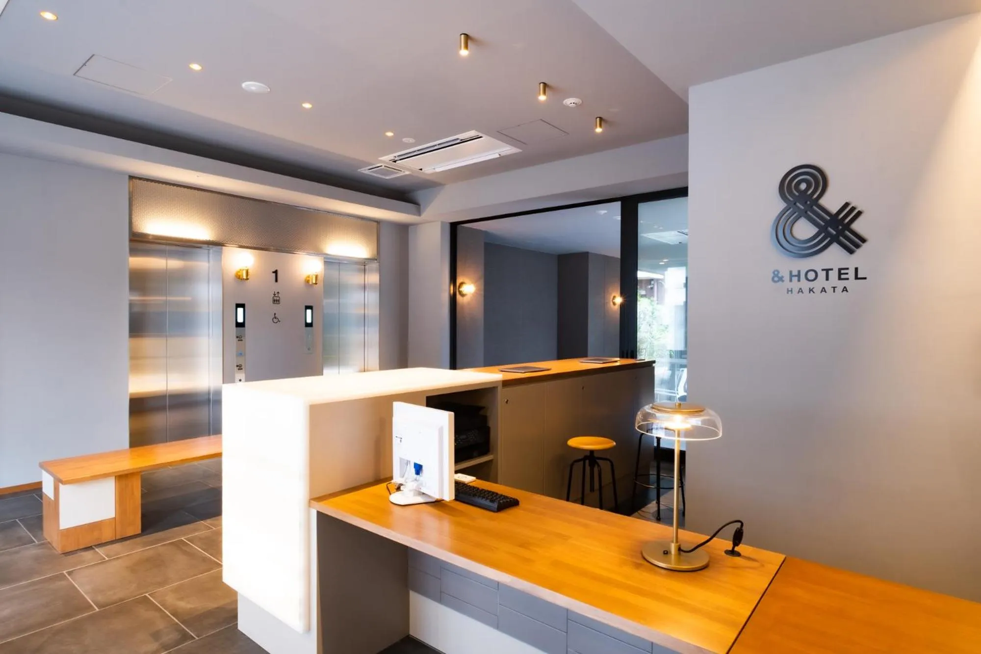 Lobby or reception in &HOTEL HAKATA