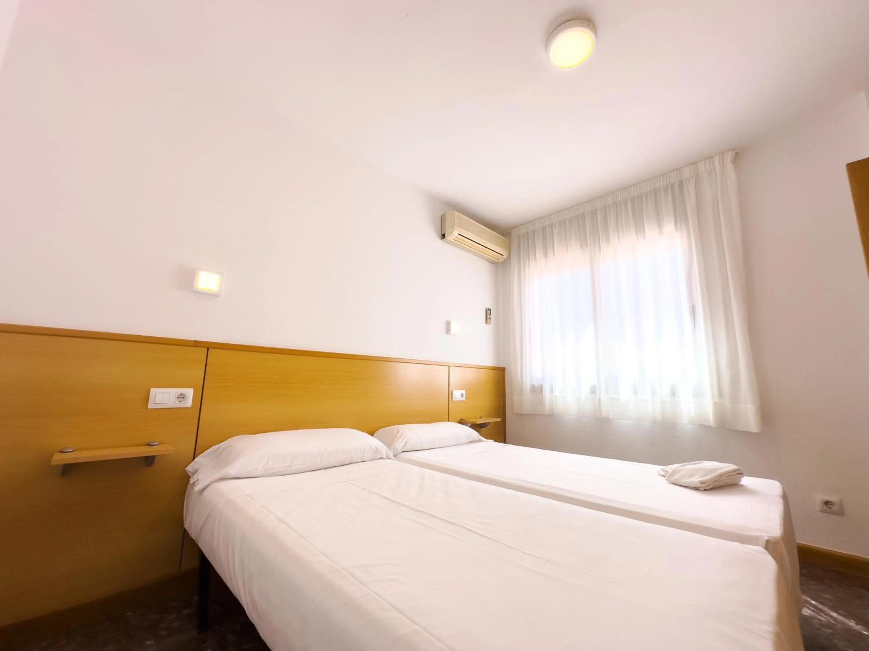 Bed in Rentalmar Atlantida Atico