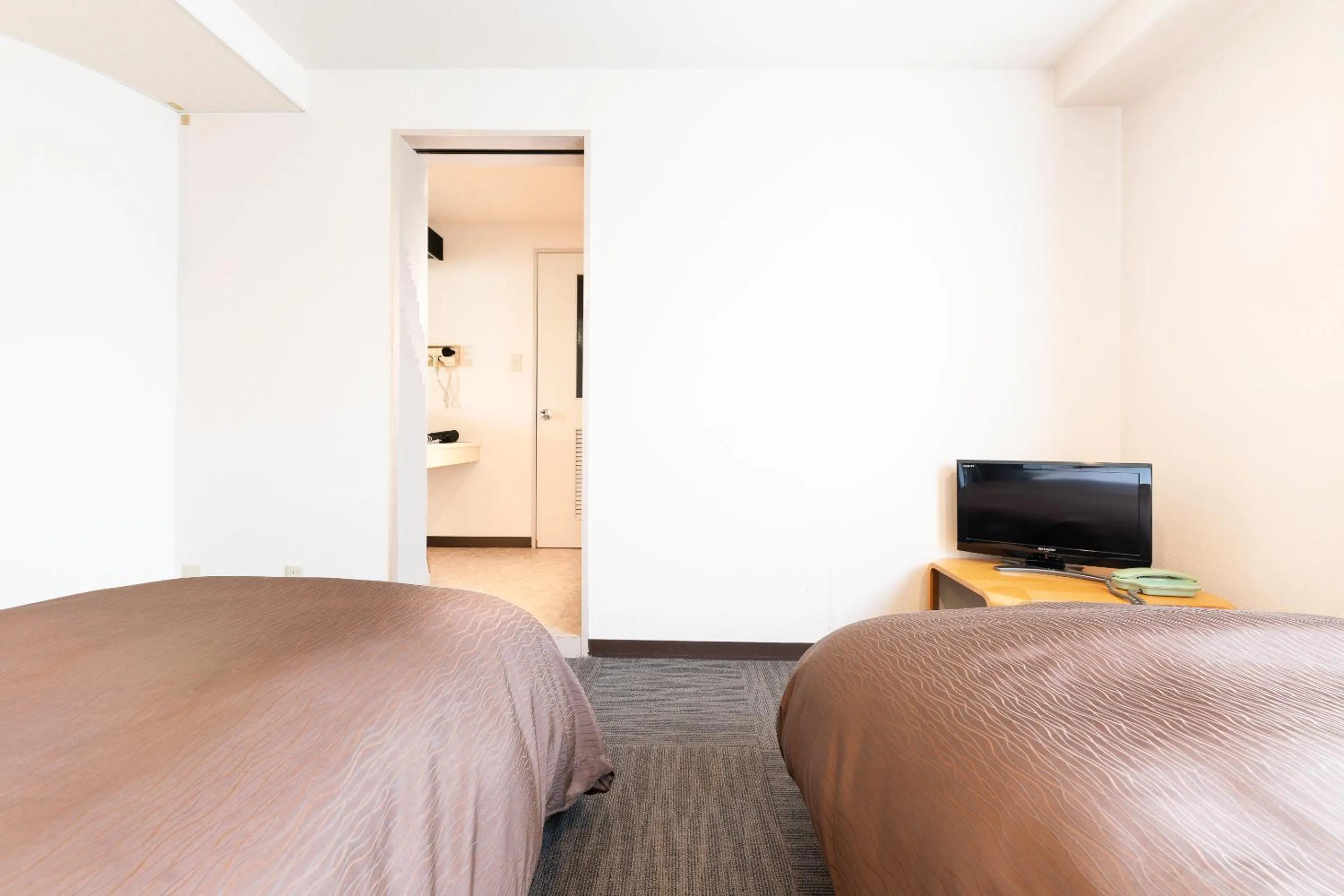 Bed in Tabist Hotel Diana Yachiyodai