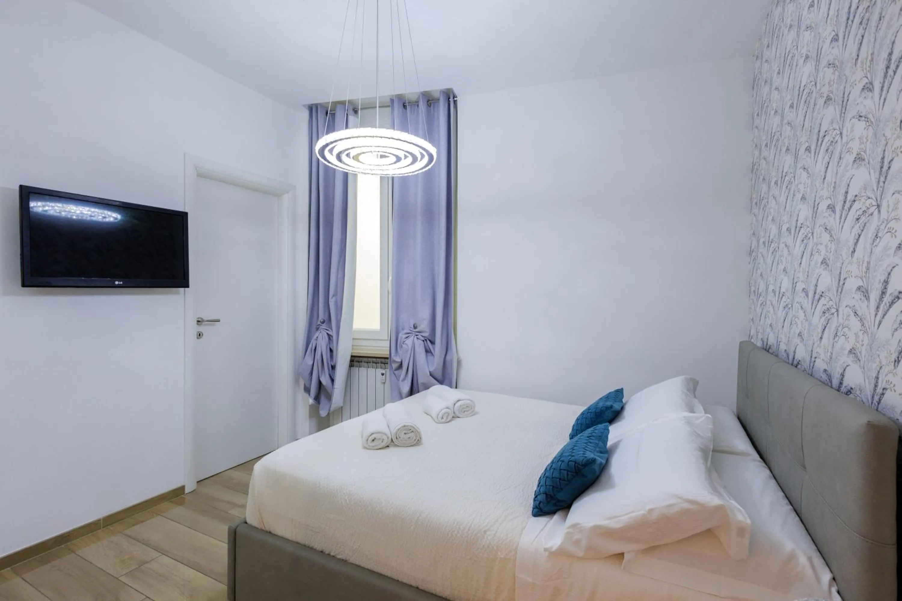 Photo of the whole room, Bed in Genoa Lux Apartments with parking