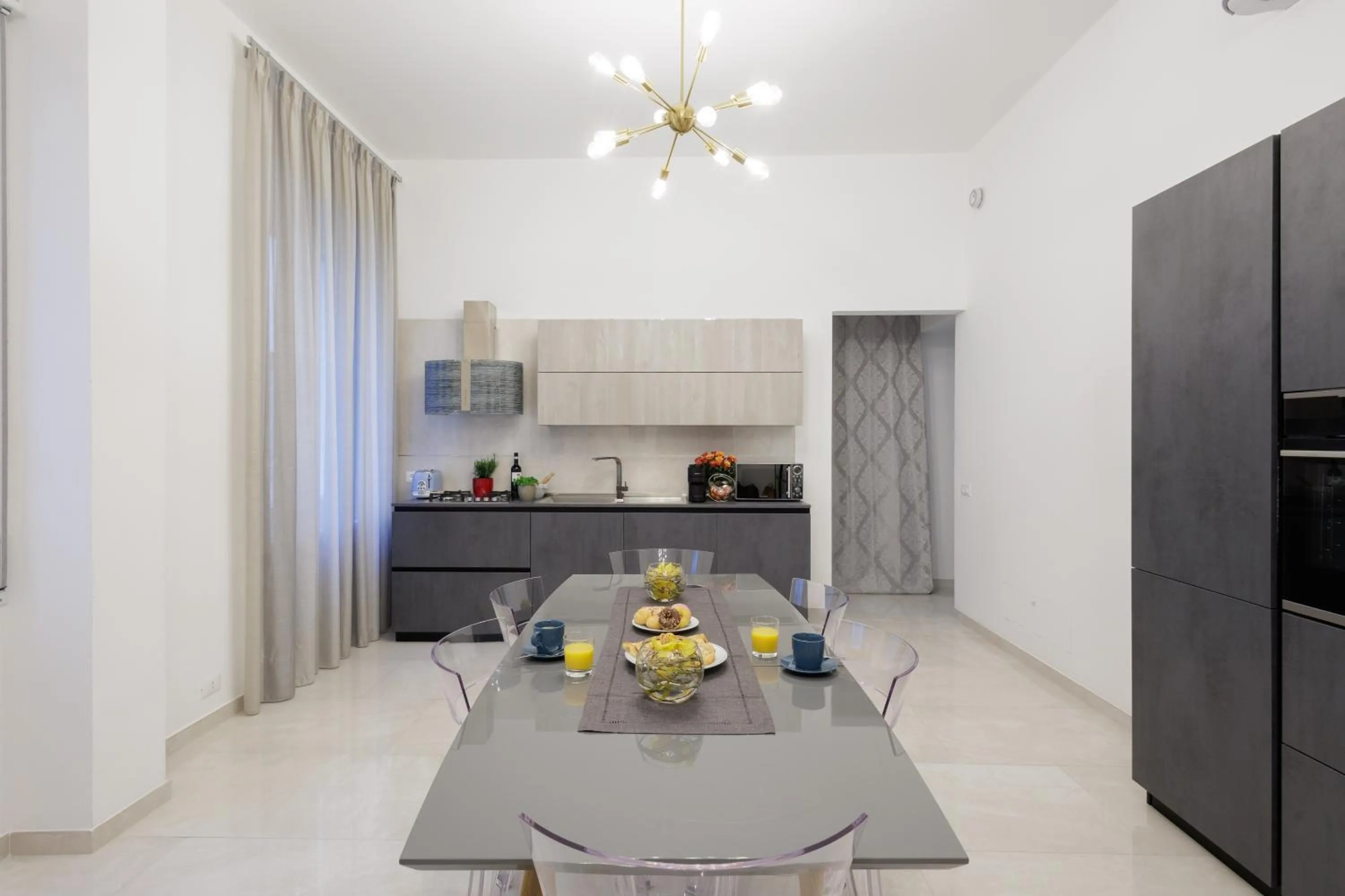 Communal lounge/ TV room in Genoa Lux Apartments with parking