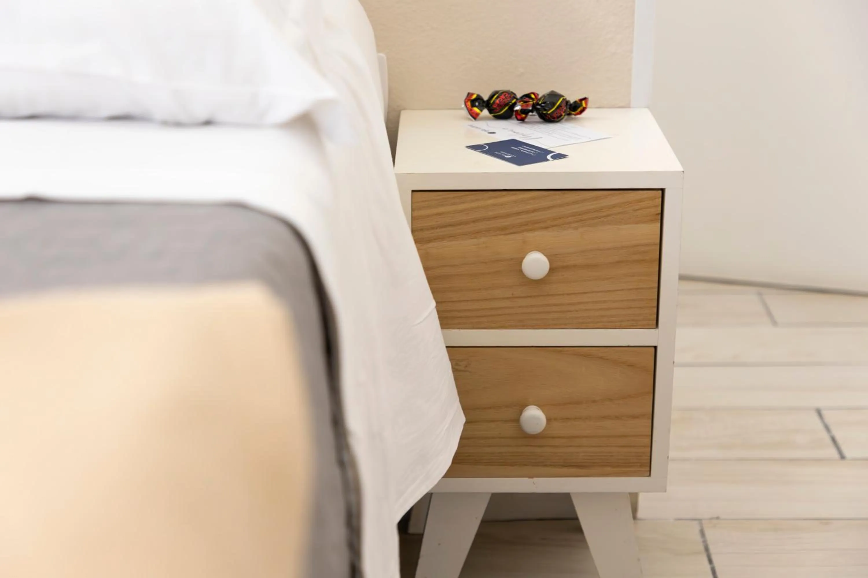 Bed in Approdo Rooms - Eja Sardinia