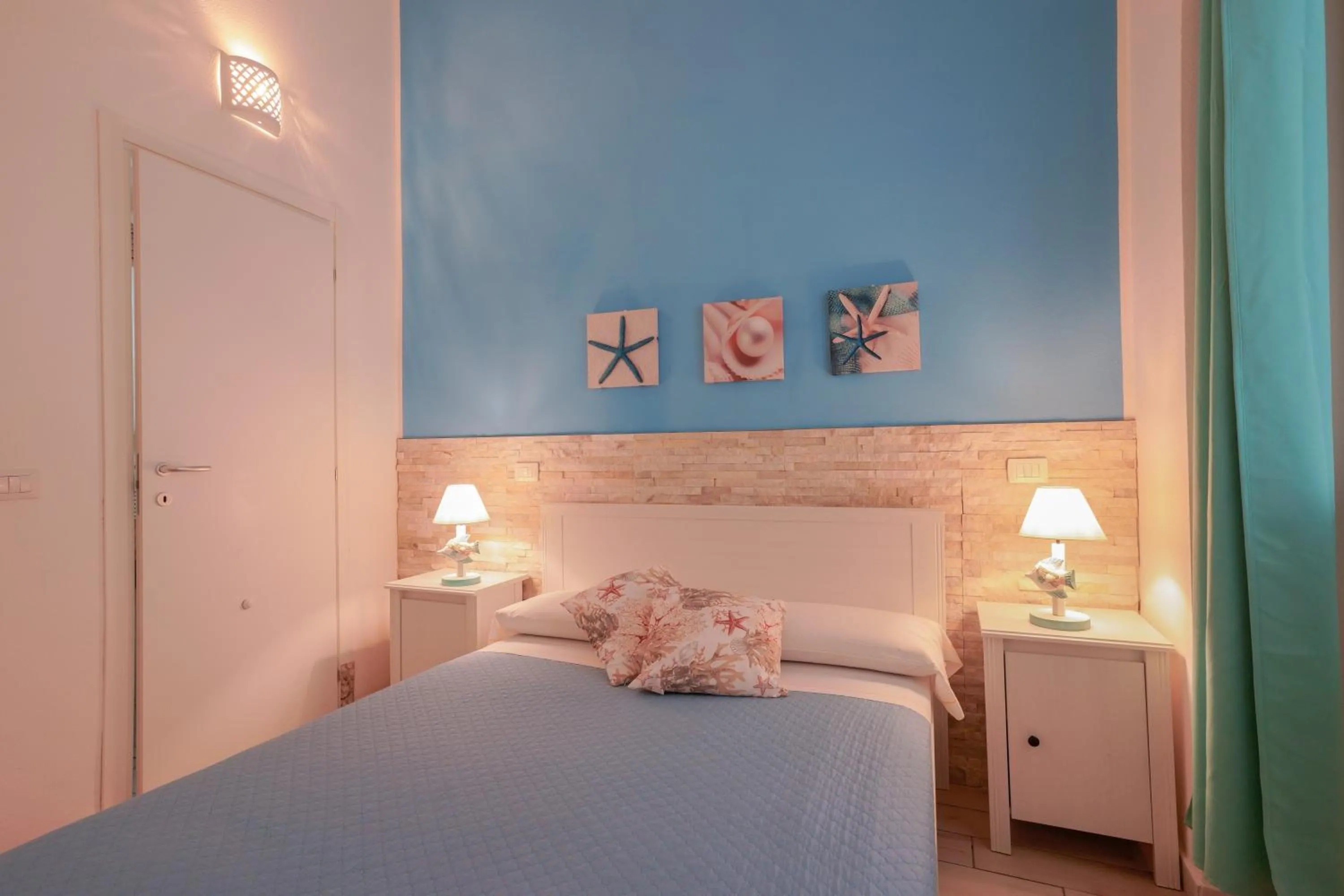Bed in Approdo Rooms - Eja Sardinia