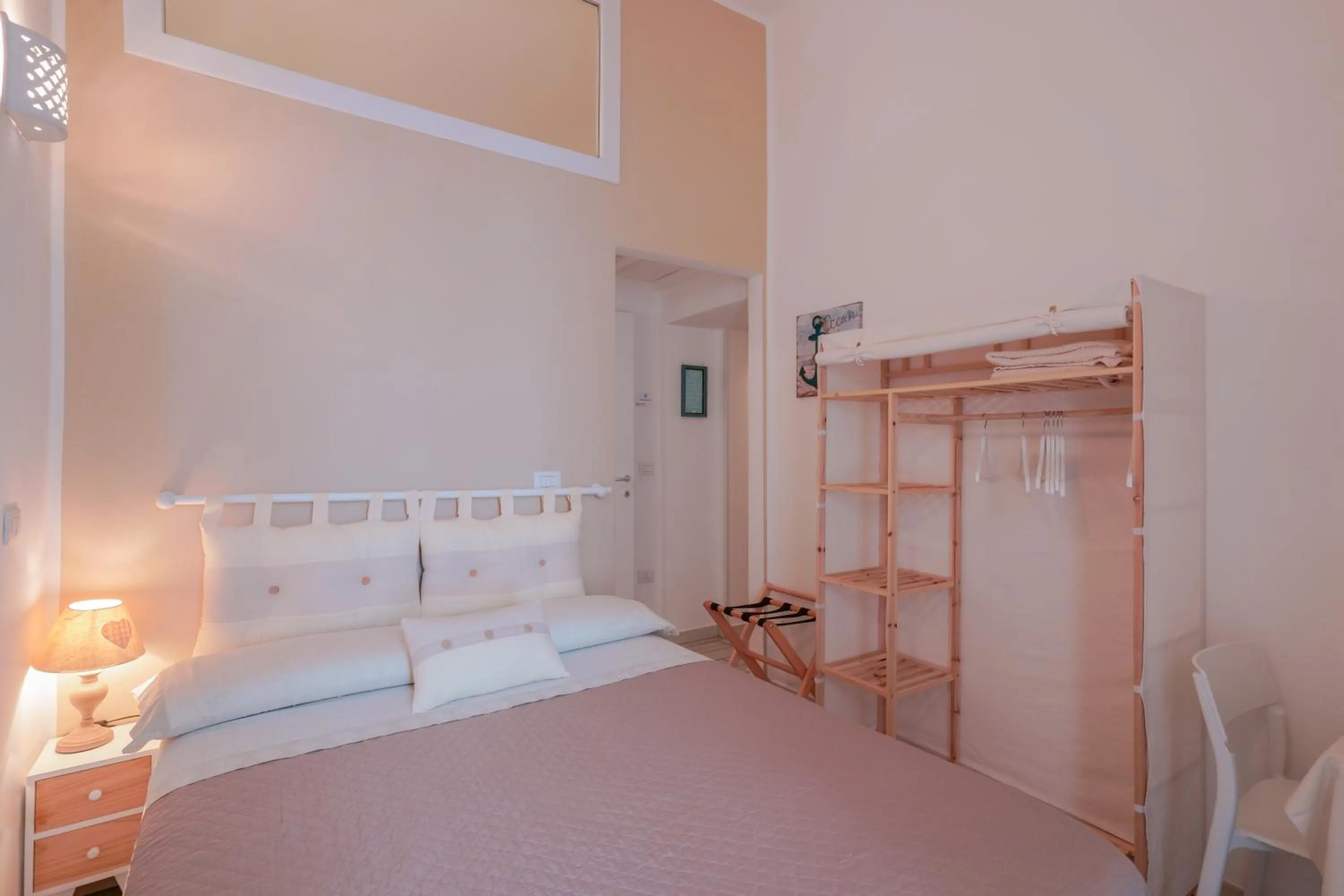 Bed in Approdo Rooms - Eja Sardinia
