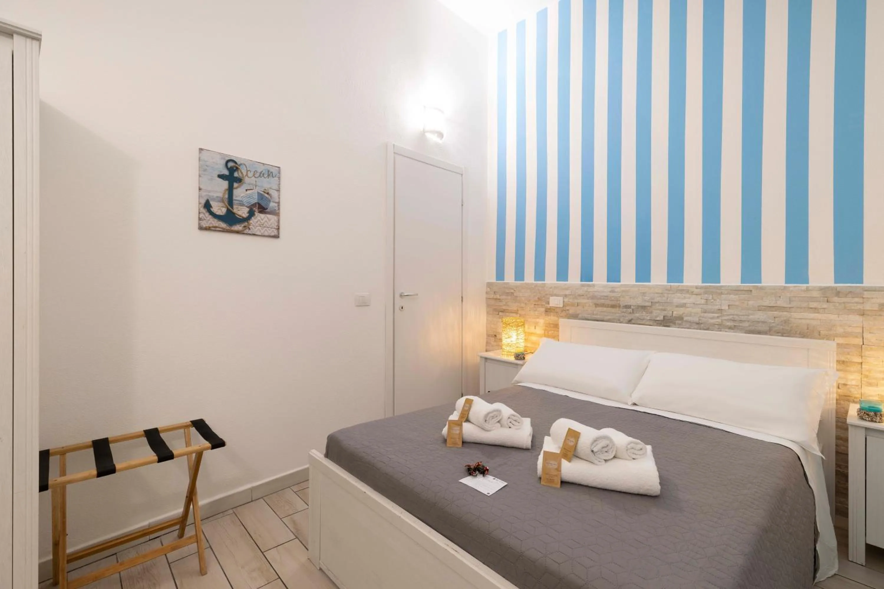 Bed in Approdo Rooms - Eja Sardinia
