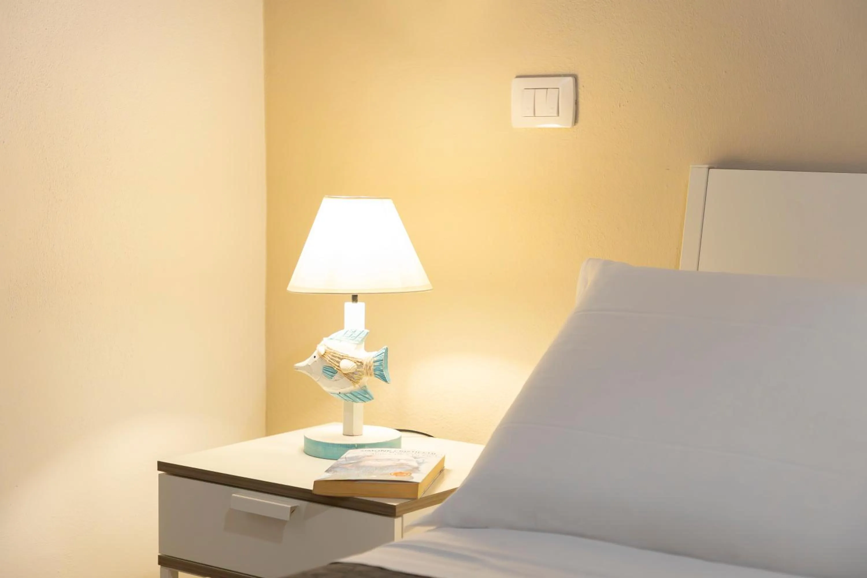 Bed in Approdo Rooms - Eja Sardinia