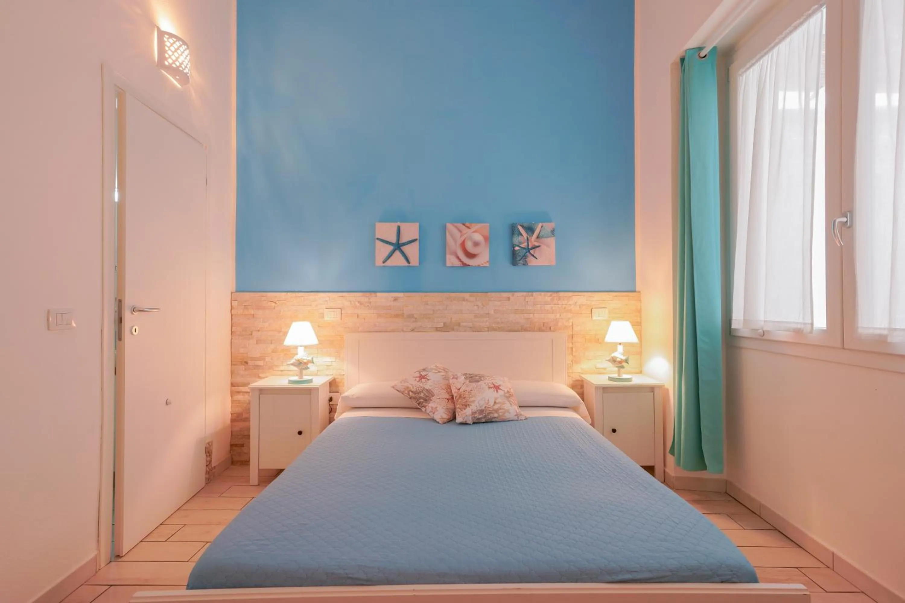 Bed in Approdo Rooms - Eja Sardinia