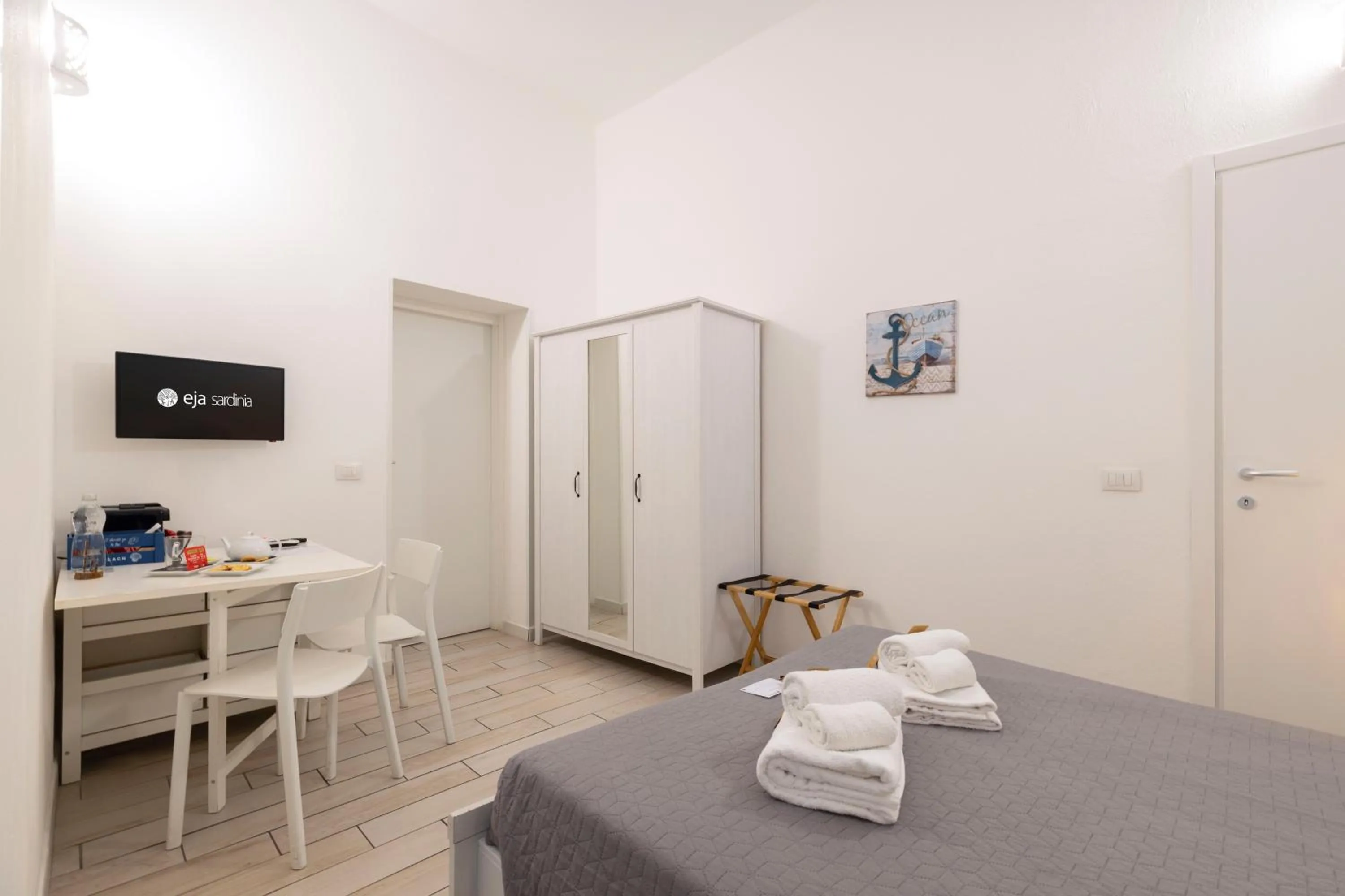 Bed in Approdo Rooms - Eja Sardinia