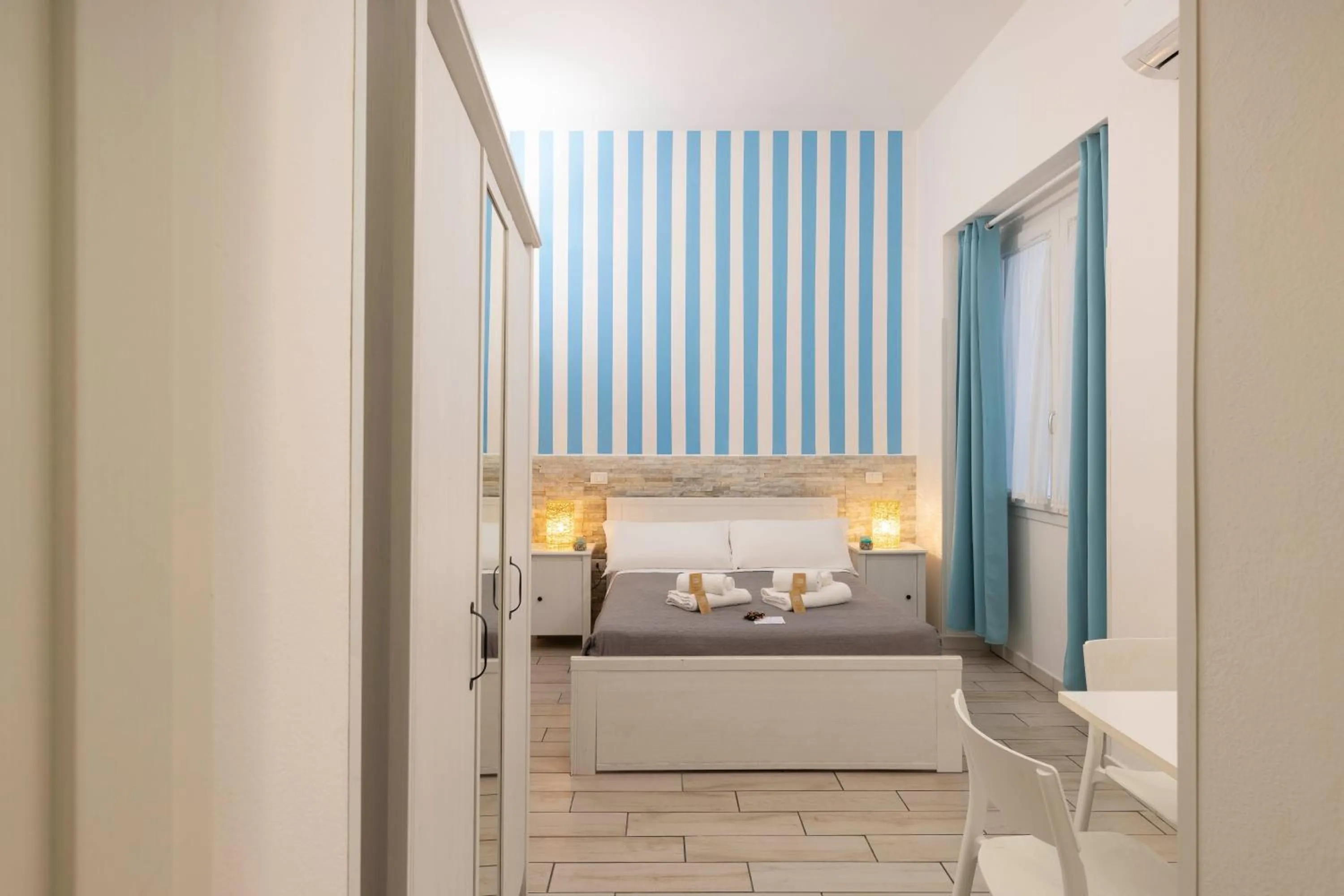 Bed in Approdo Rooms - Eja Sardinia