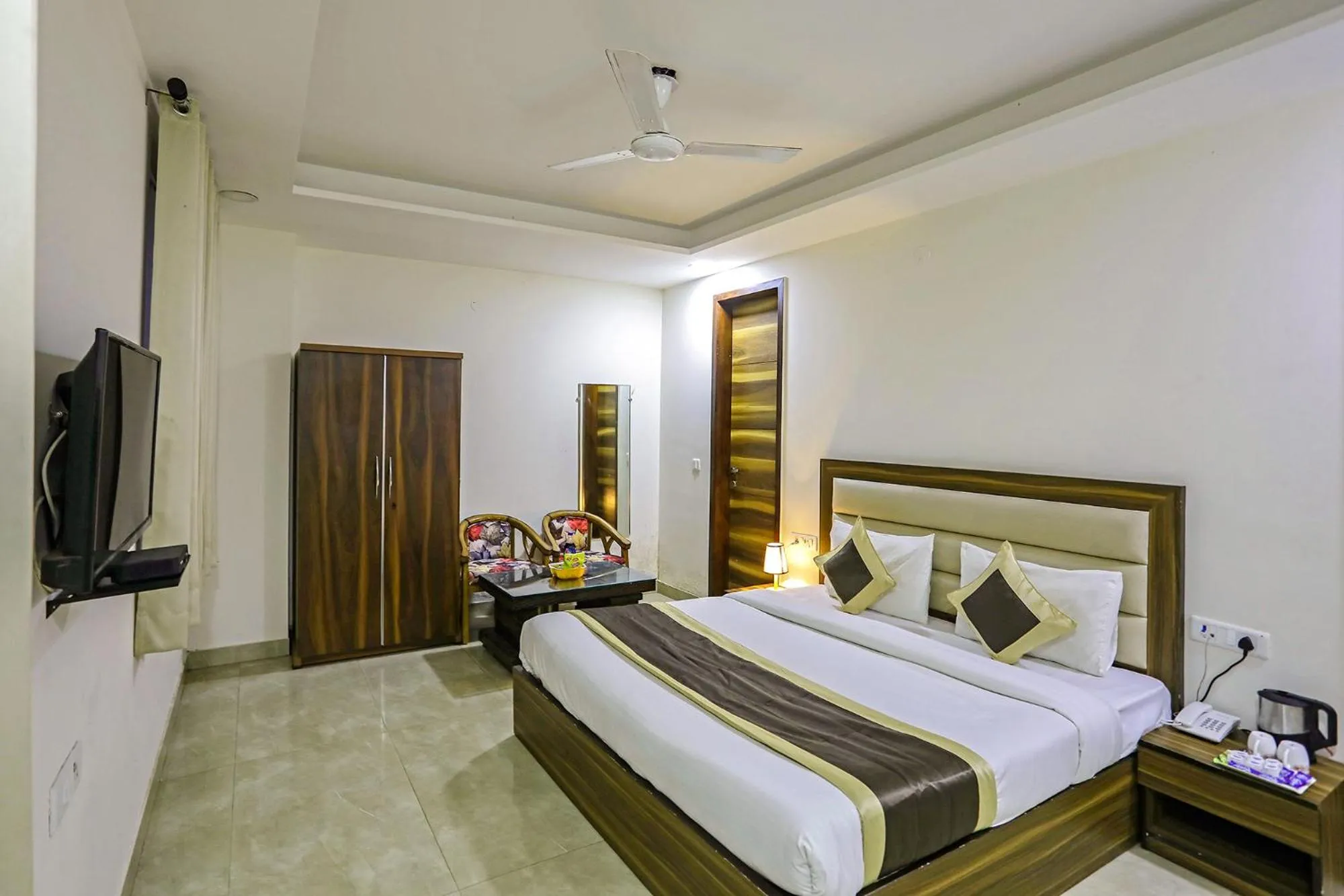 TV and multimedia, Bed in FabHotel White House BNB - Nr Yashobhoomi Convention Centre