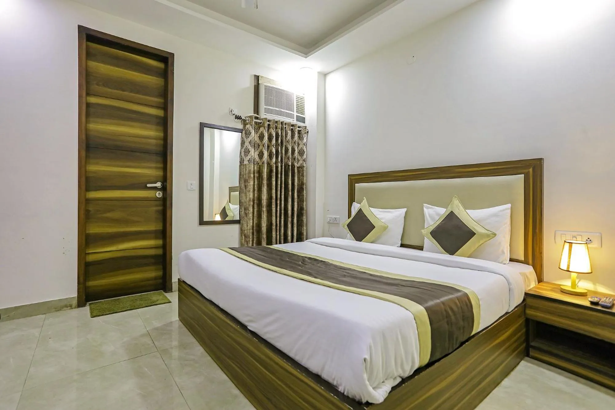 Photo of the whole room, Bed in FabHotel White House BNB - Nr Yashobhoomi Convention Centre