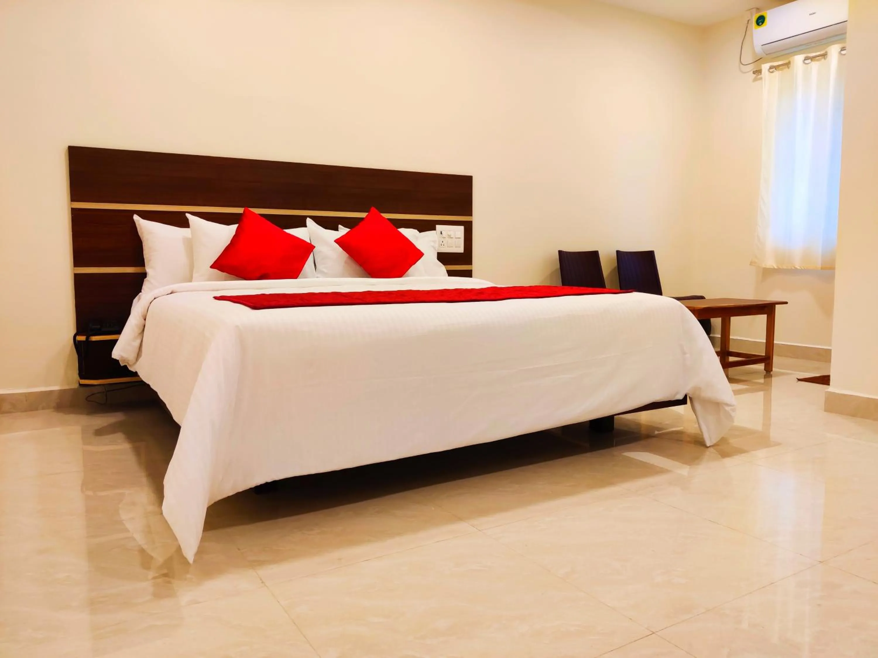 Photo of the whole room, Bed in THAAI RESIDENCY