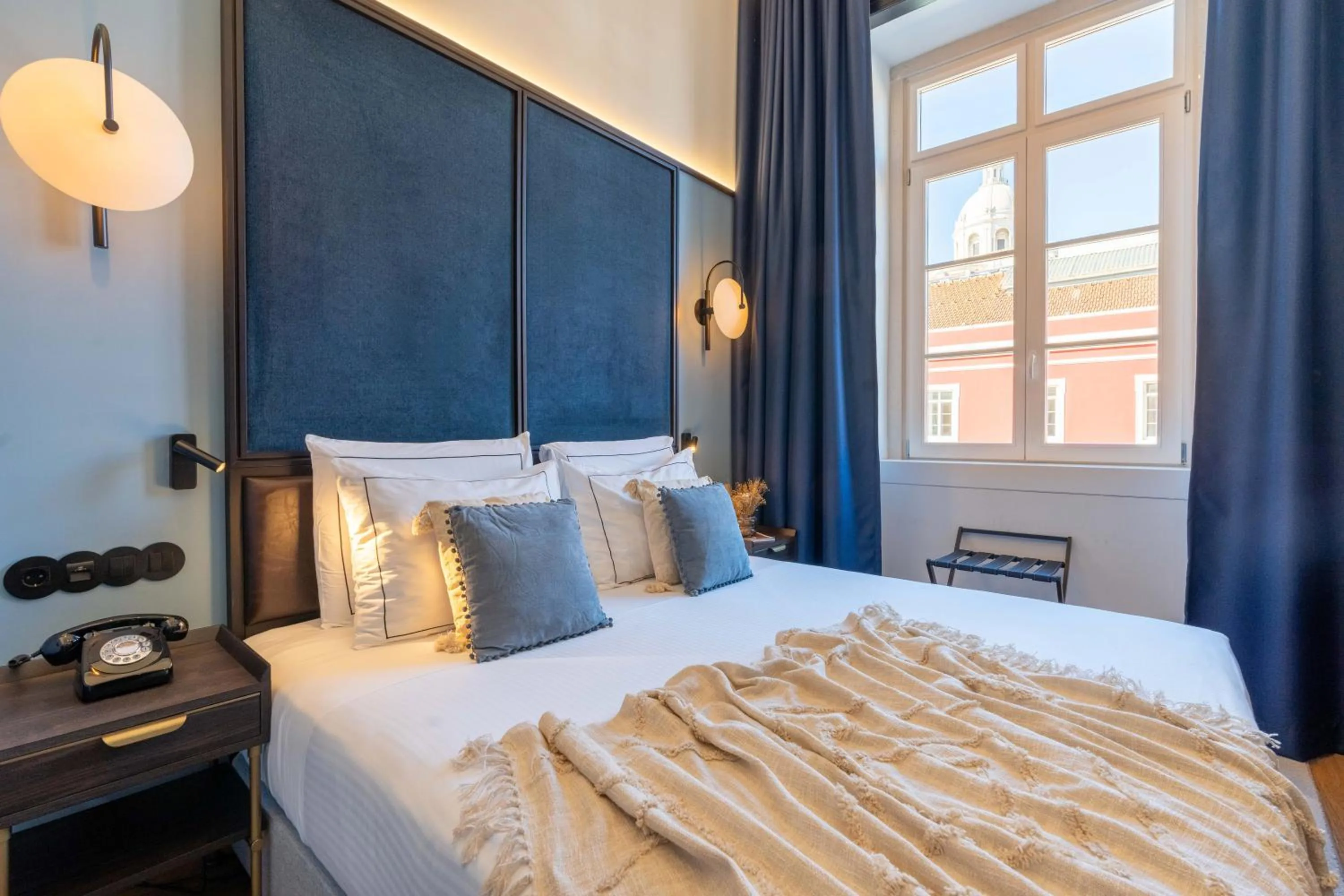 Bed in The Editory Riverside Hotel, an Historic Hotel