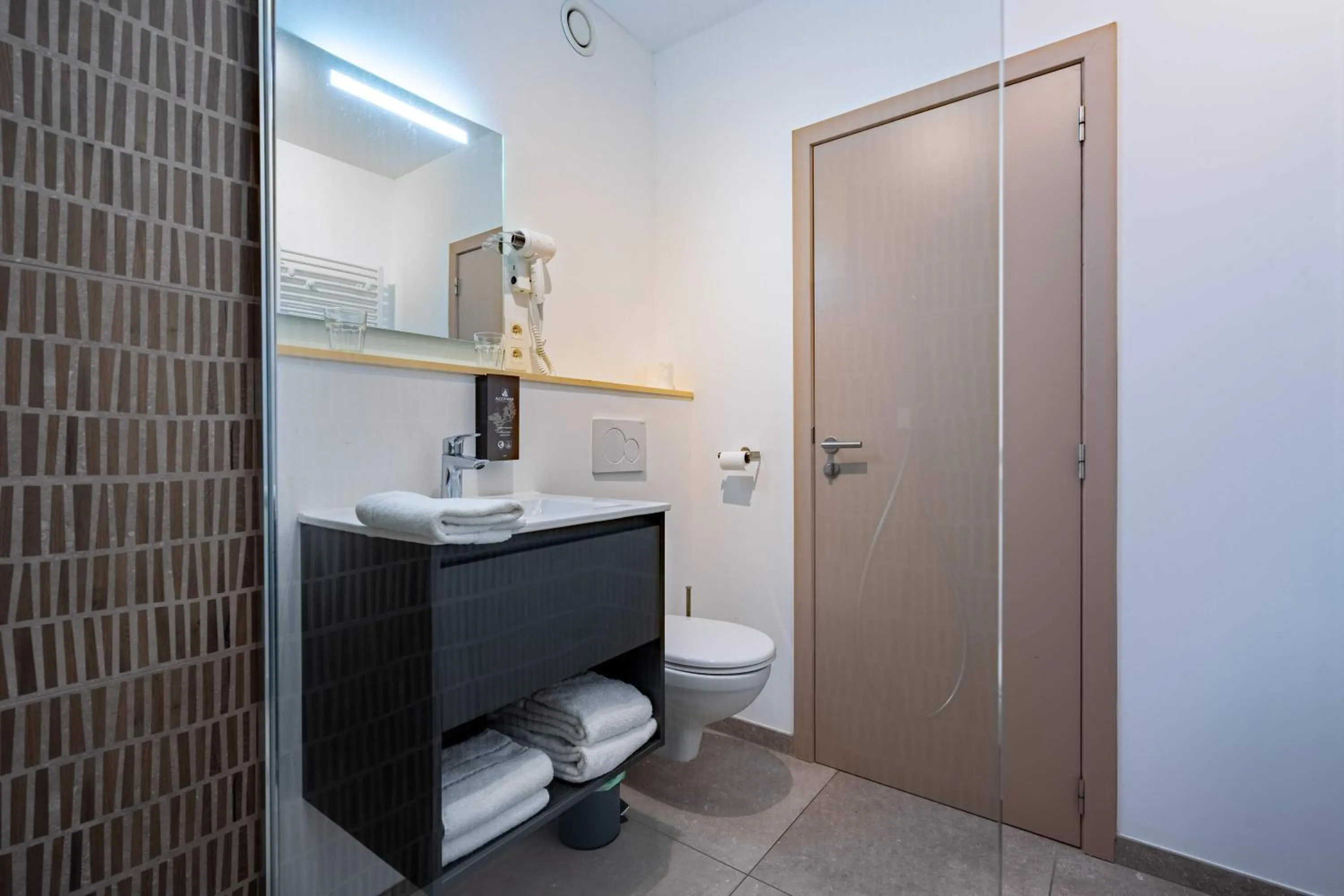 Toilet in Appart hôtel En Ville