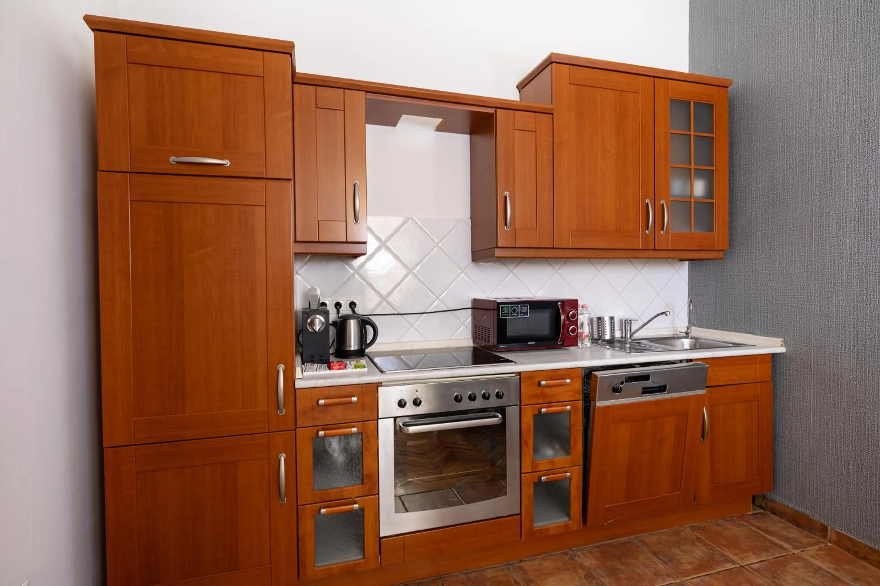 Kitchen or kitchenette in City Hotel Matyas