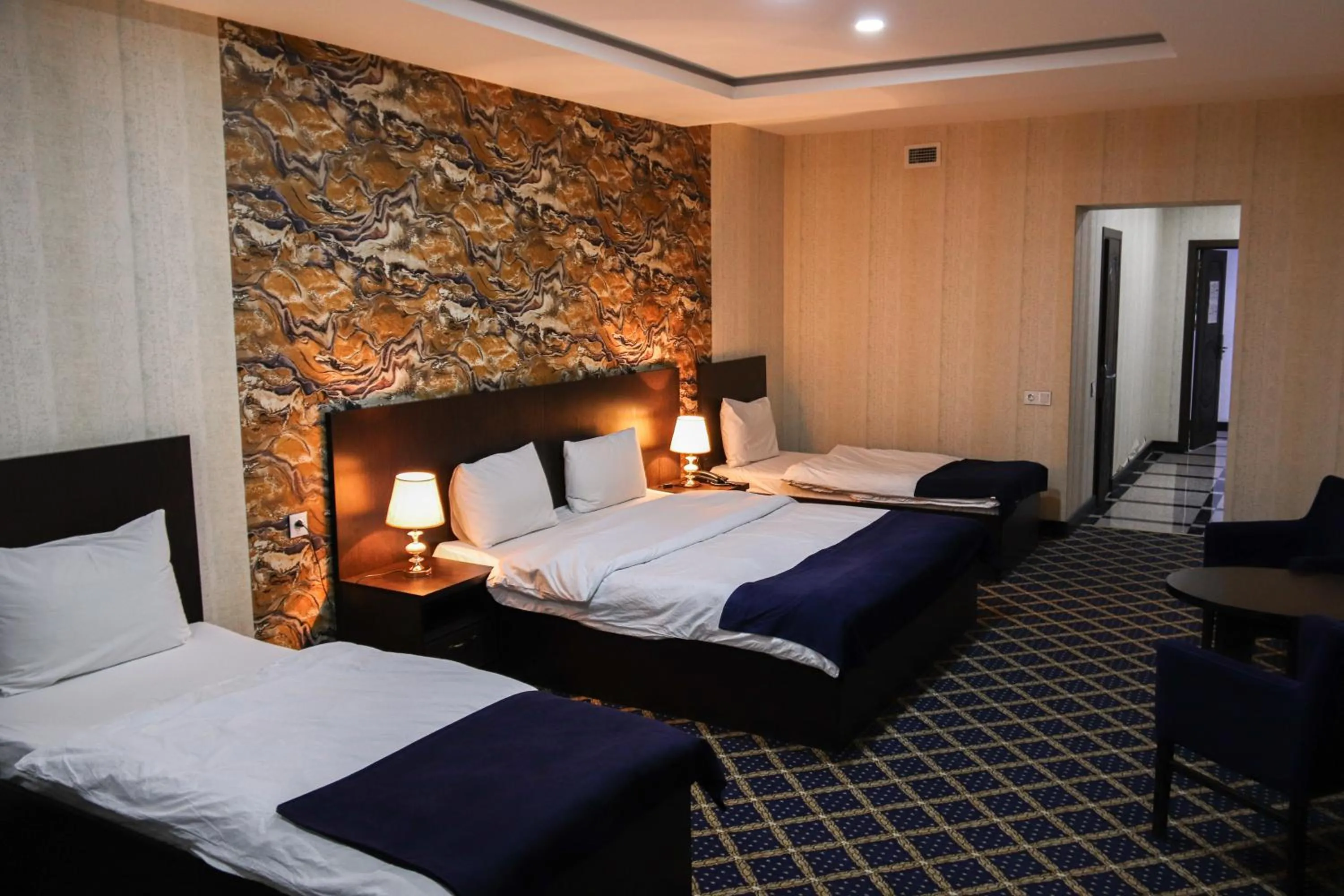 Bed in Kristal Inn Hotel