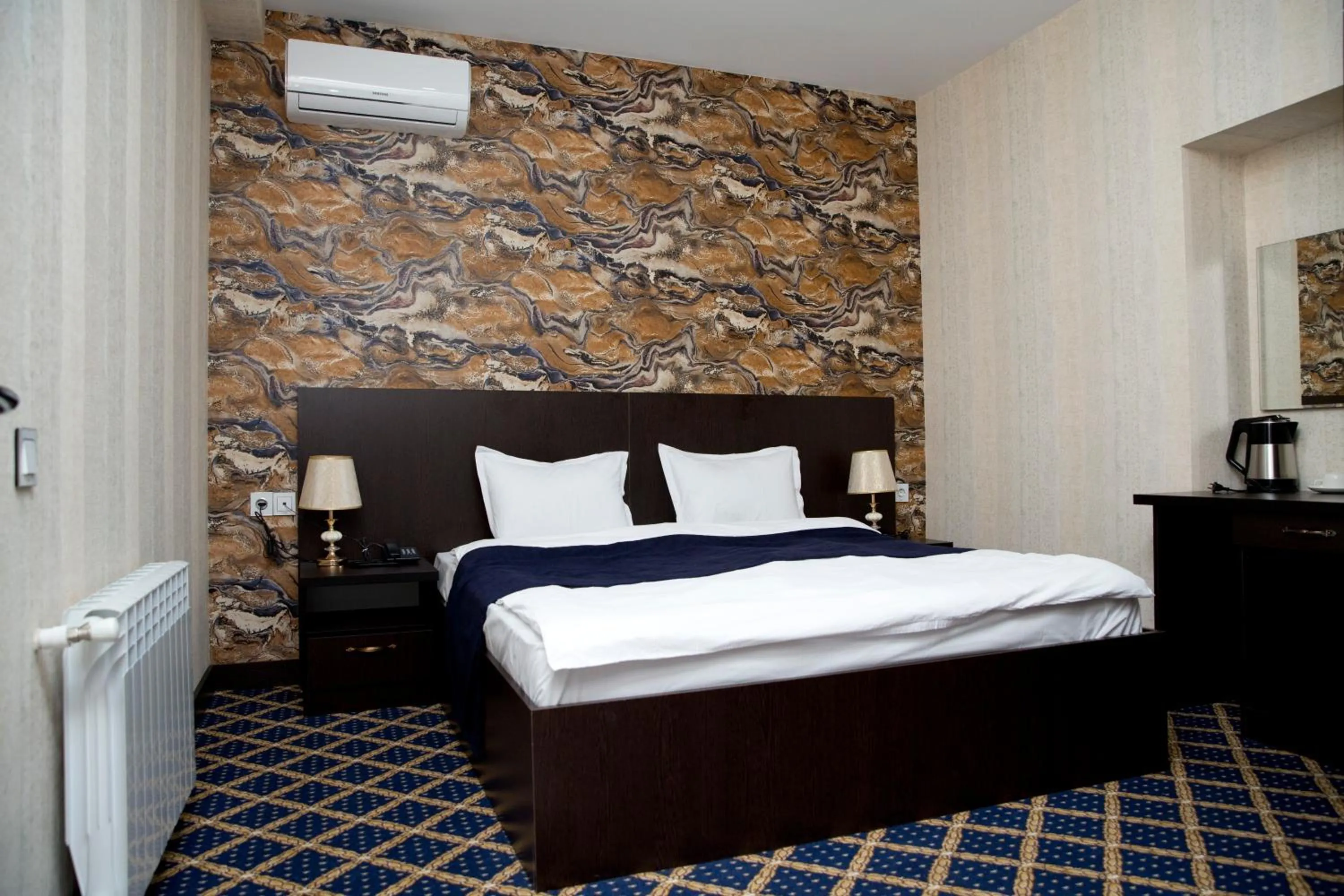 Bed in Kristal Inn Hotel