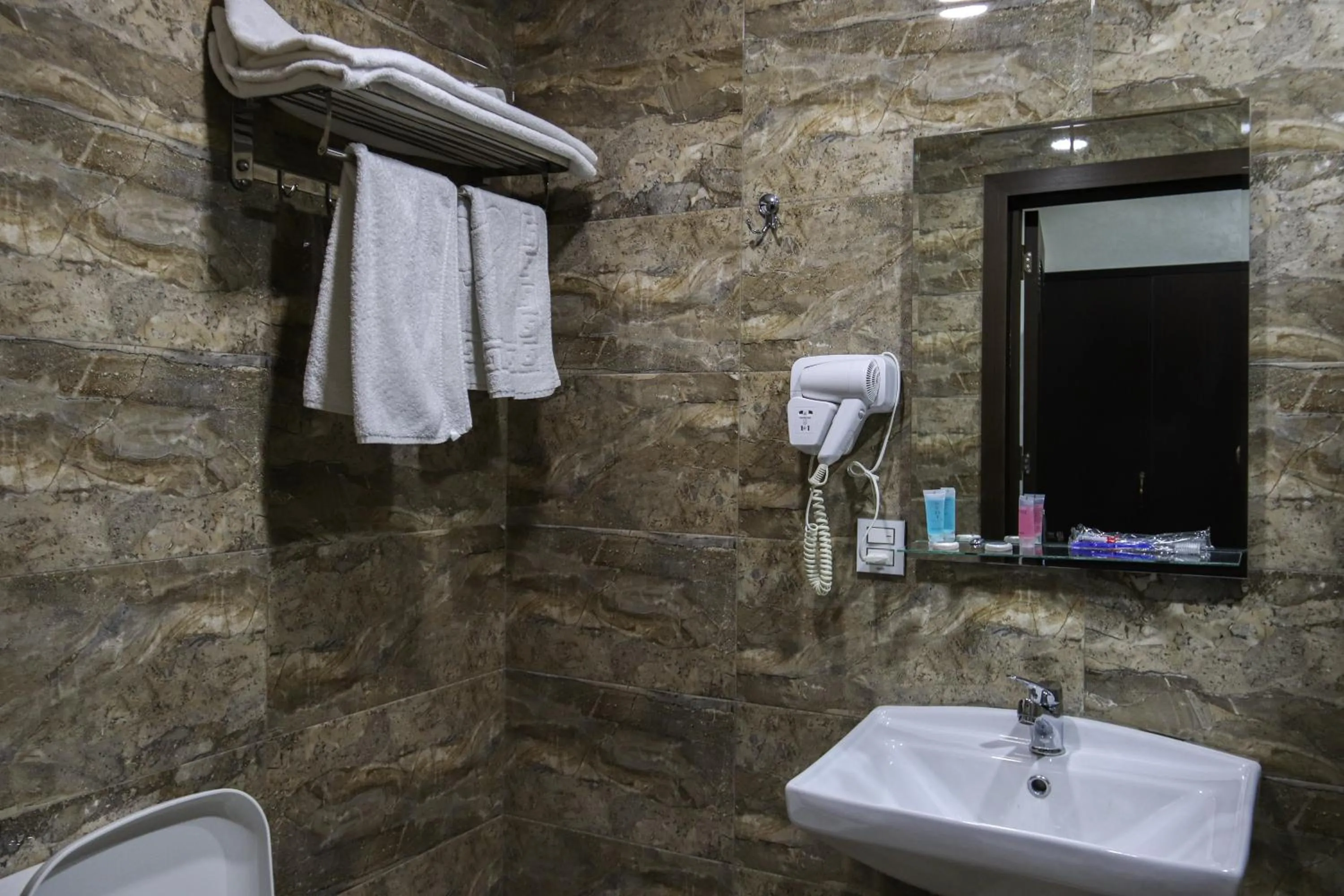 Bathroom in Kristal Inn Hotel