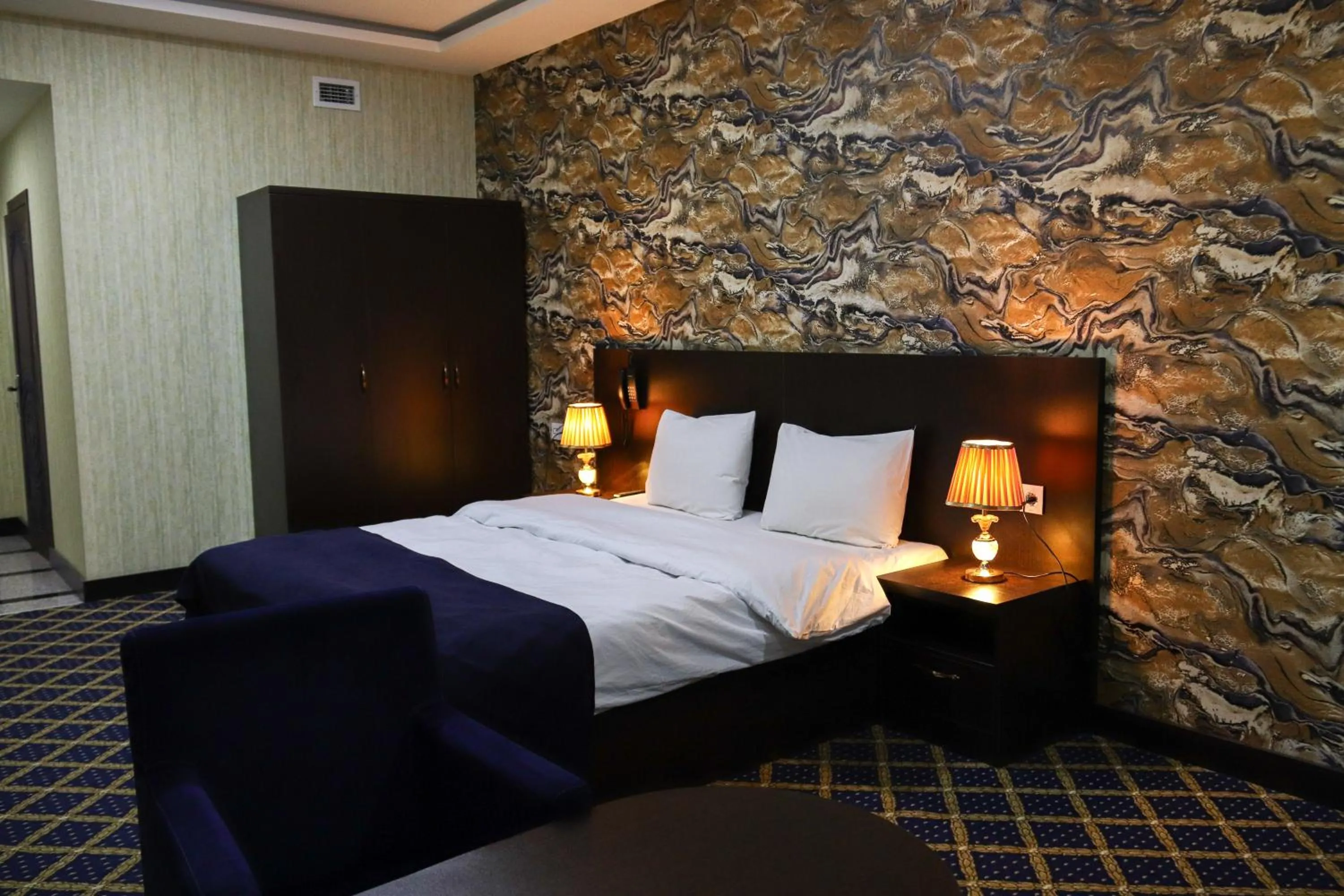 Bed in Kristal Inn Hotel