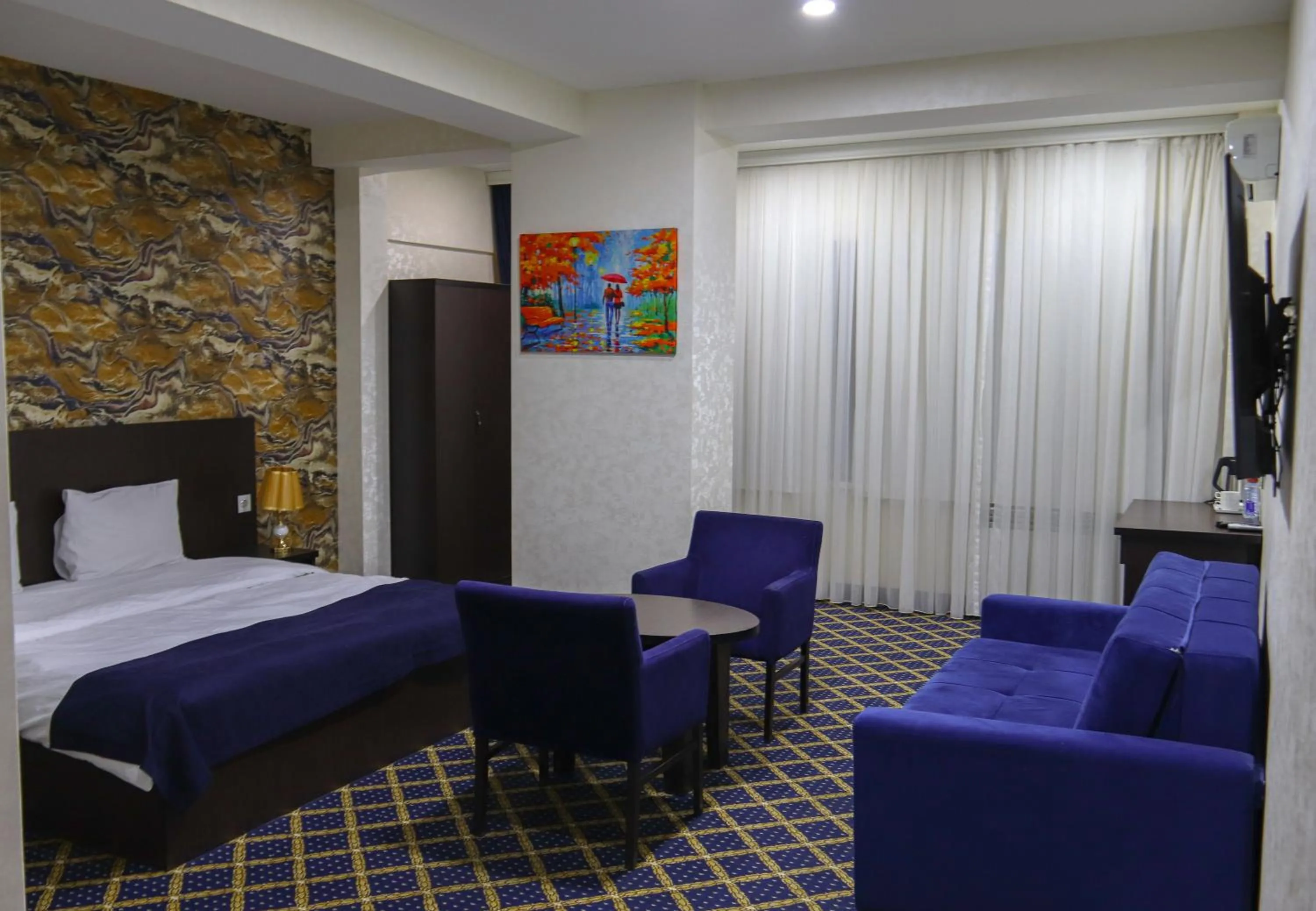 Bed in Kristal Inn Hotel