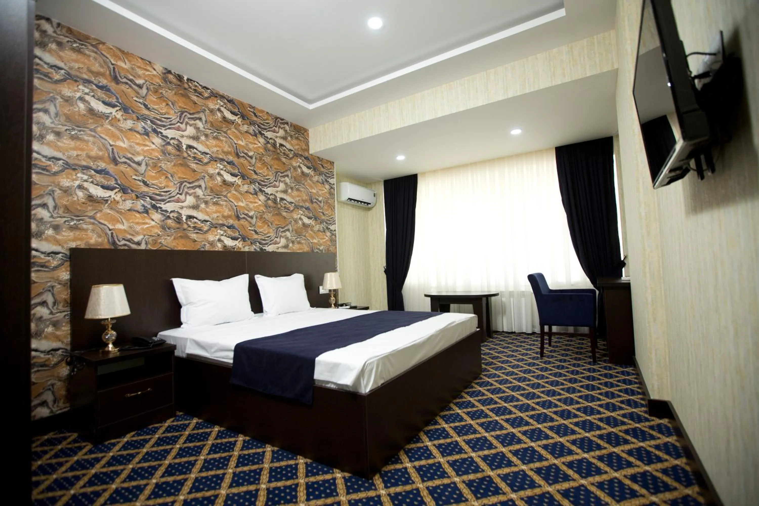 Bed in Kristal Inn Hotel
