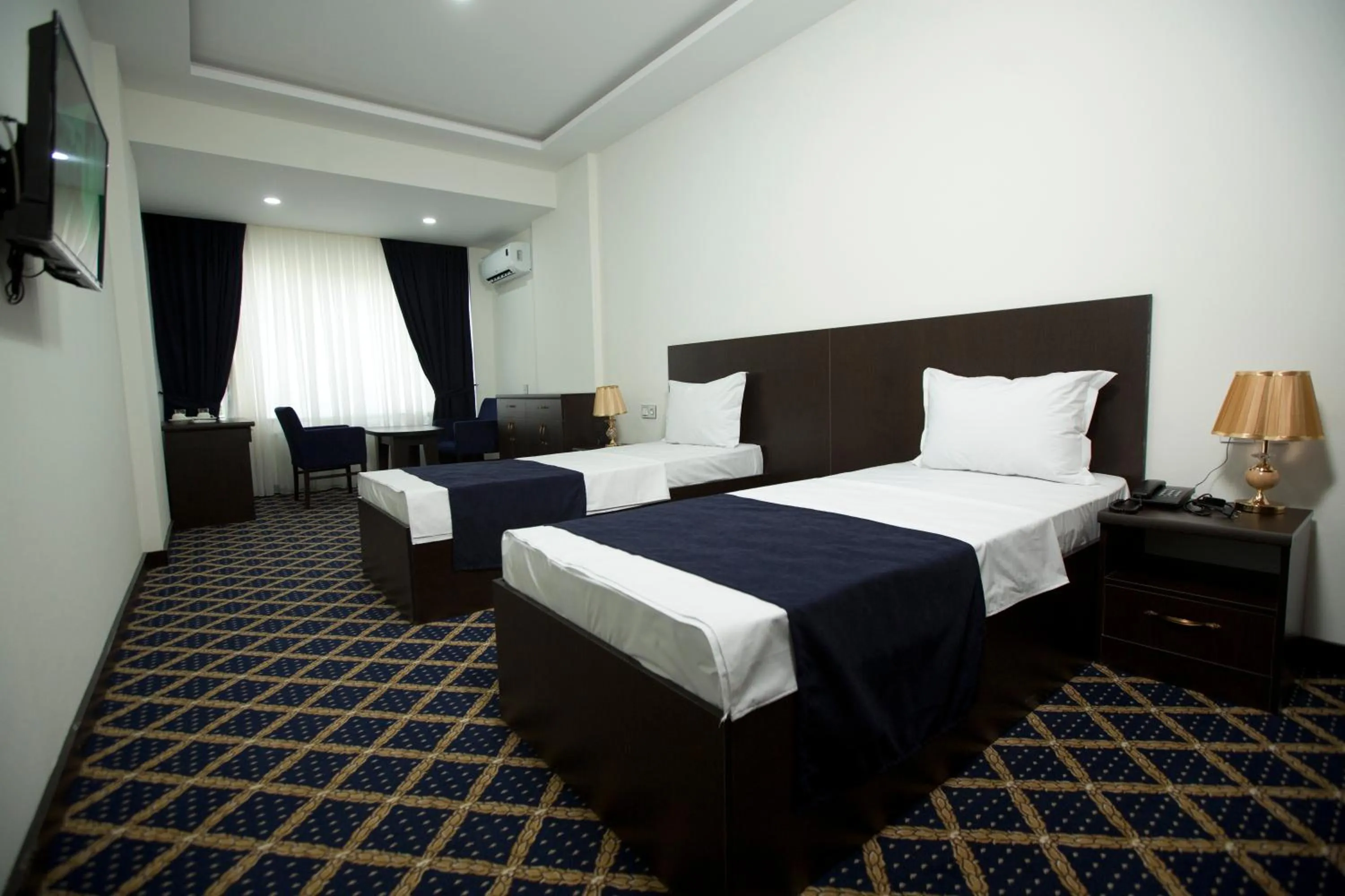 Bed in Kristal Inn Hotel