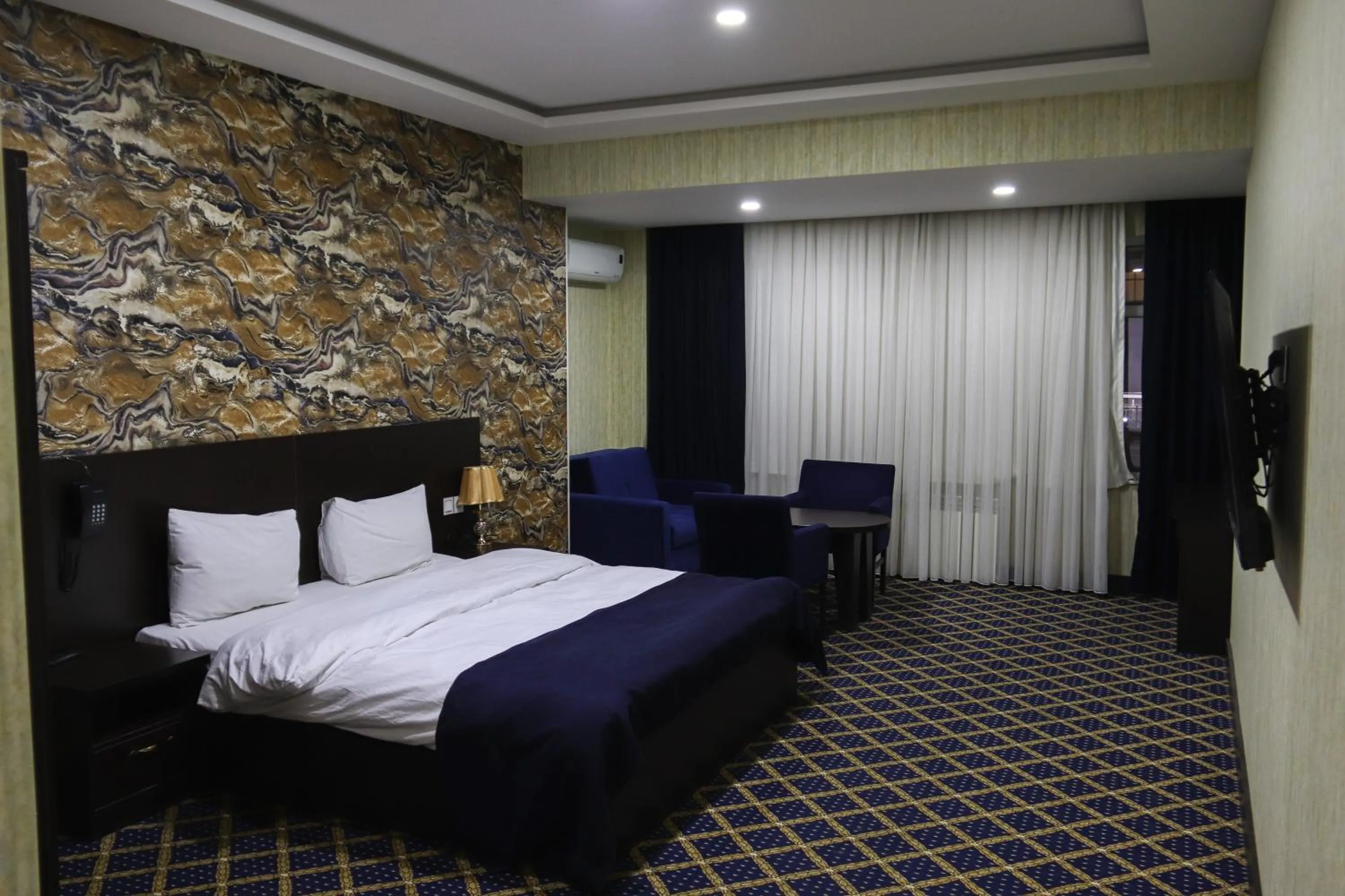 Bed in Kristal Inn Hotel