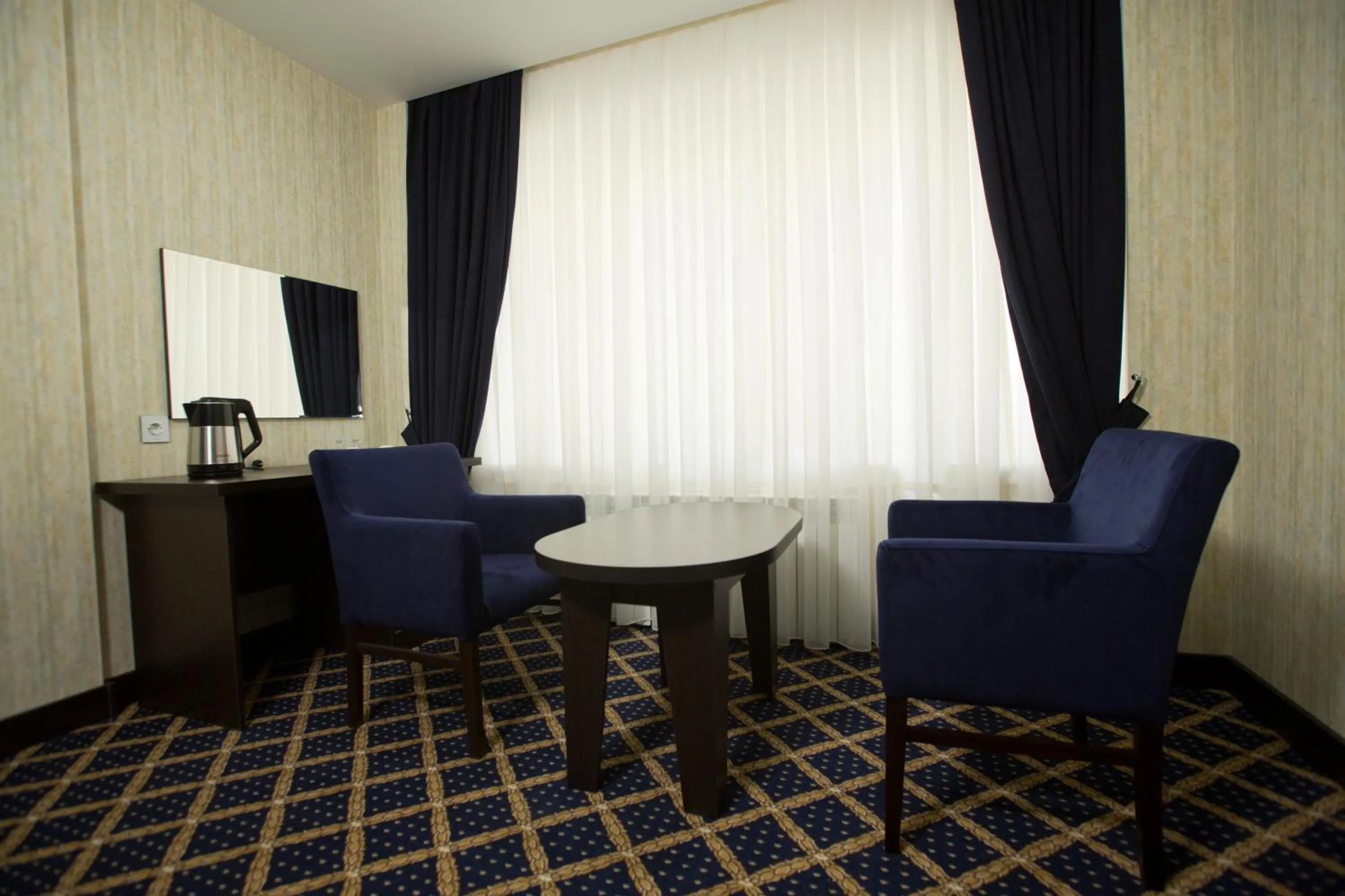 Living room in Kristal Inn Hotel