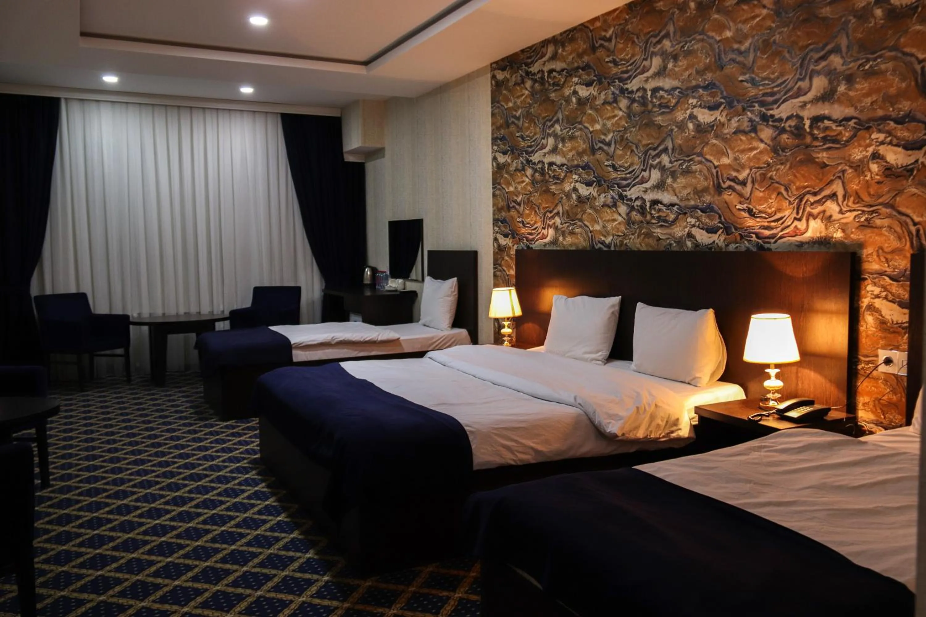 Bed in Kristal Inn Hotel