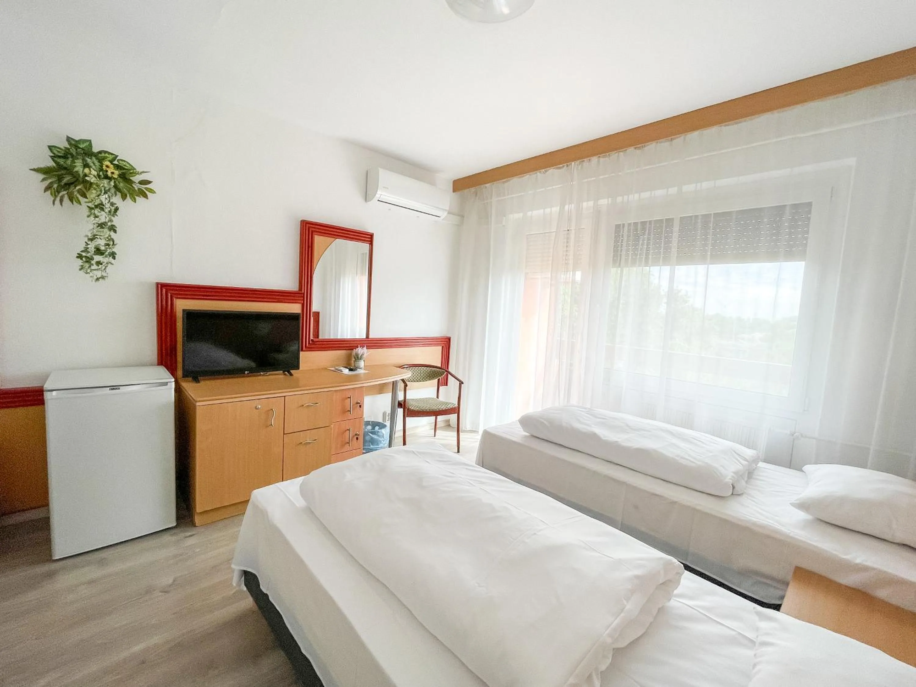 Bed in Tisza Sport Hotel