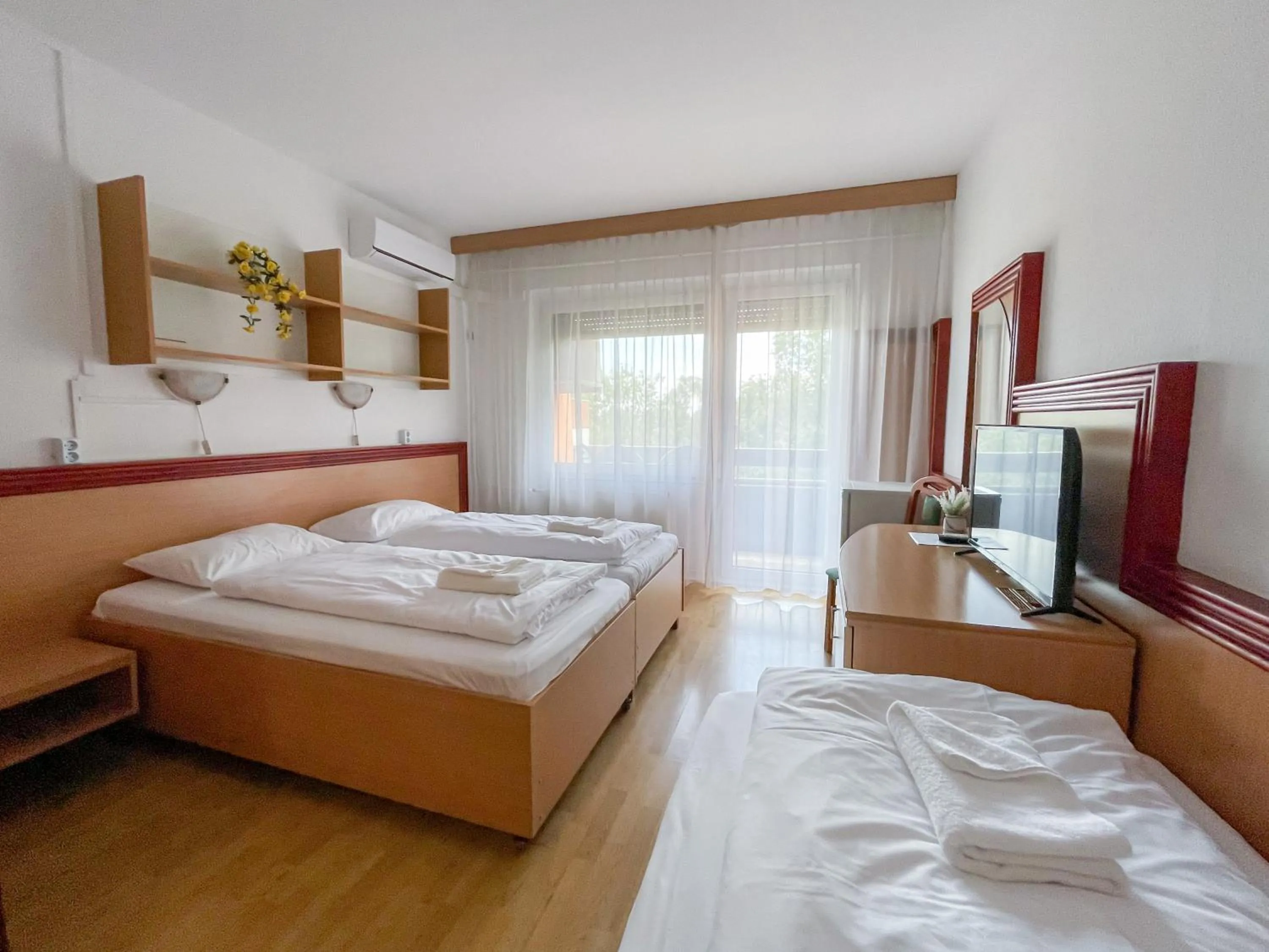 Bed in Tisza Sport Hotel