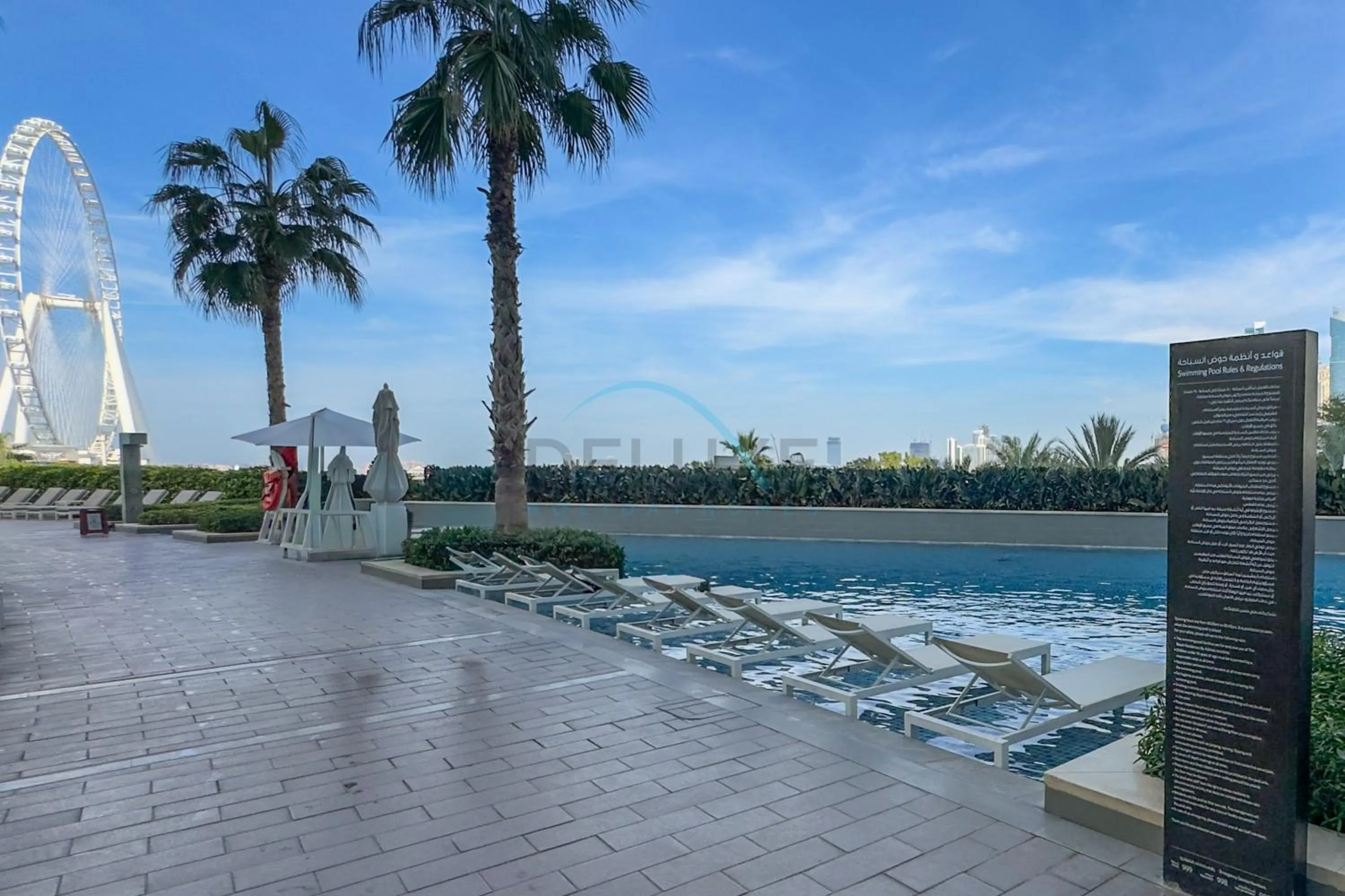 Swimming pool in Exquisite 1BR at The Address Residences in JBR by Deluxe Holiday Homes