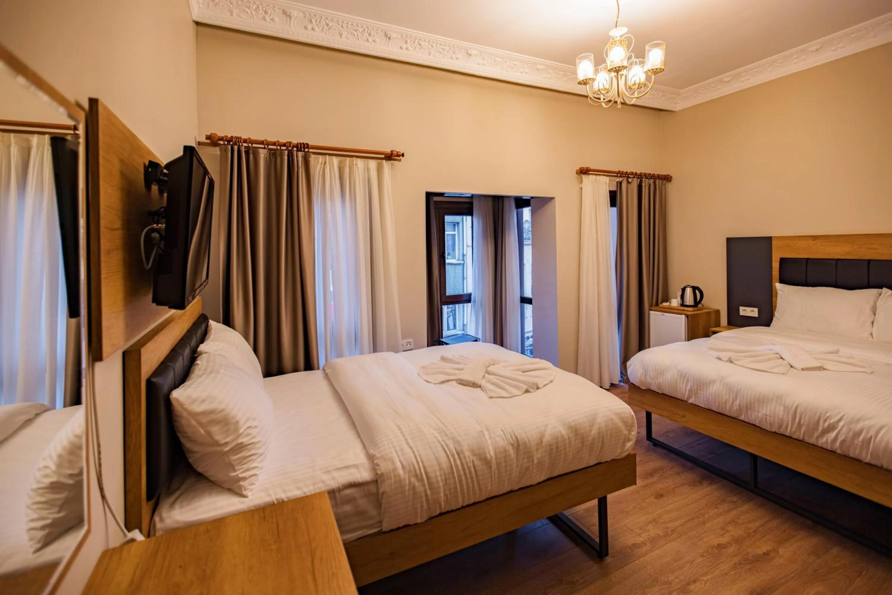 Bed in Grand Balyan Hotel & Restaurant