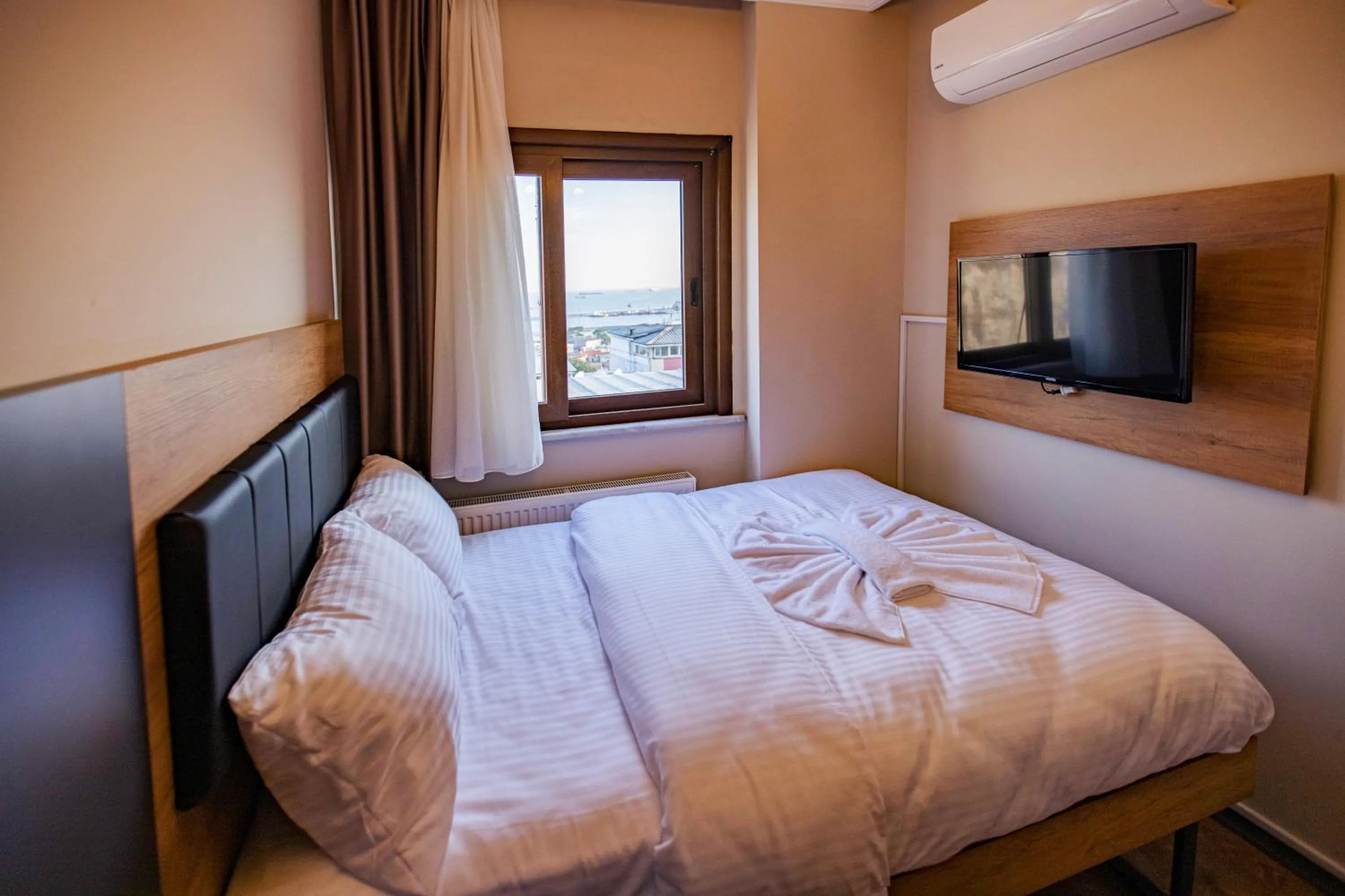 Bed in Grand Balyan Hotel & Restaurant