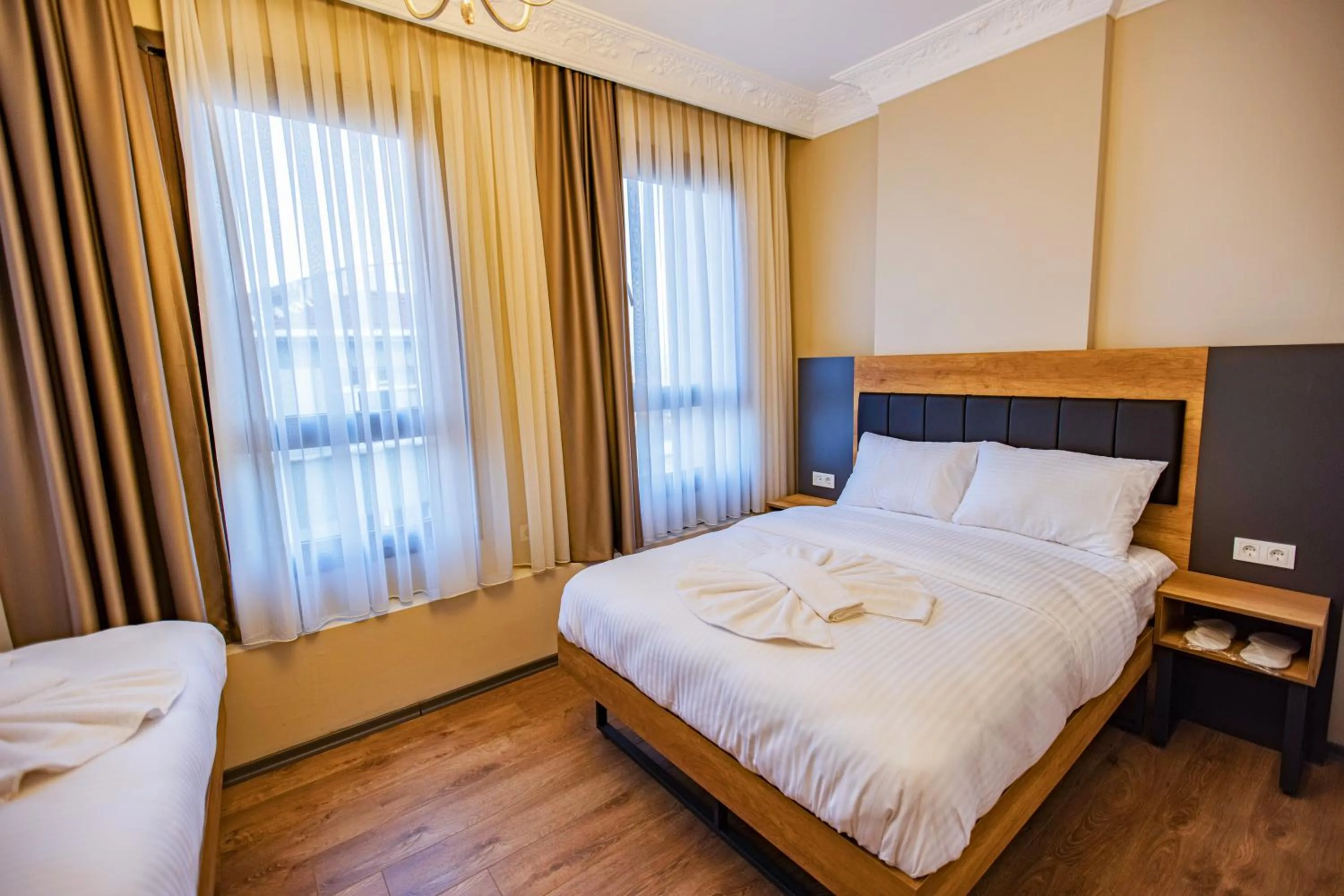 Bed in Grand Balyan Hotel & Restaurant