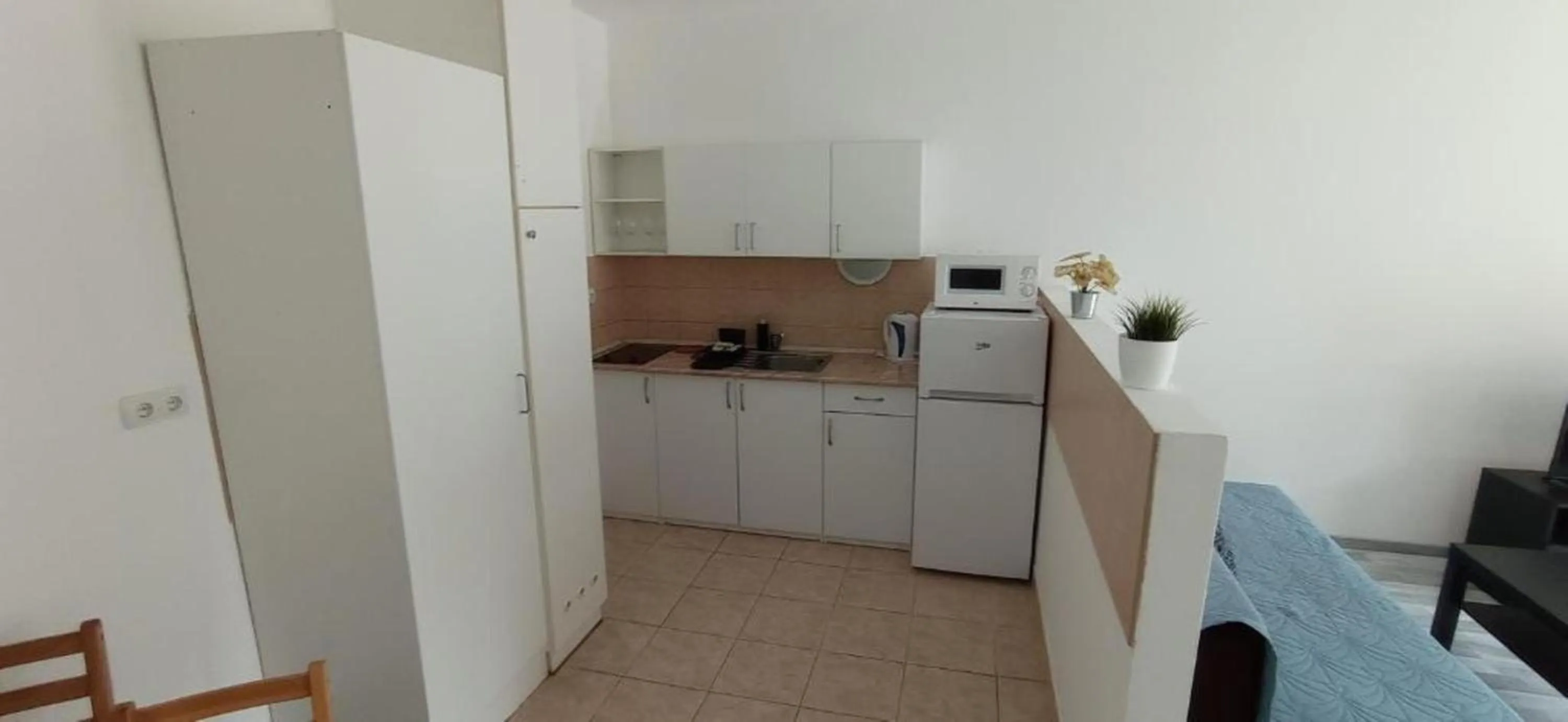 Kitchen or kitchenette in Agape Apartments