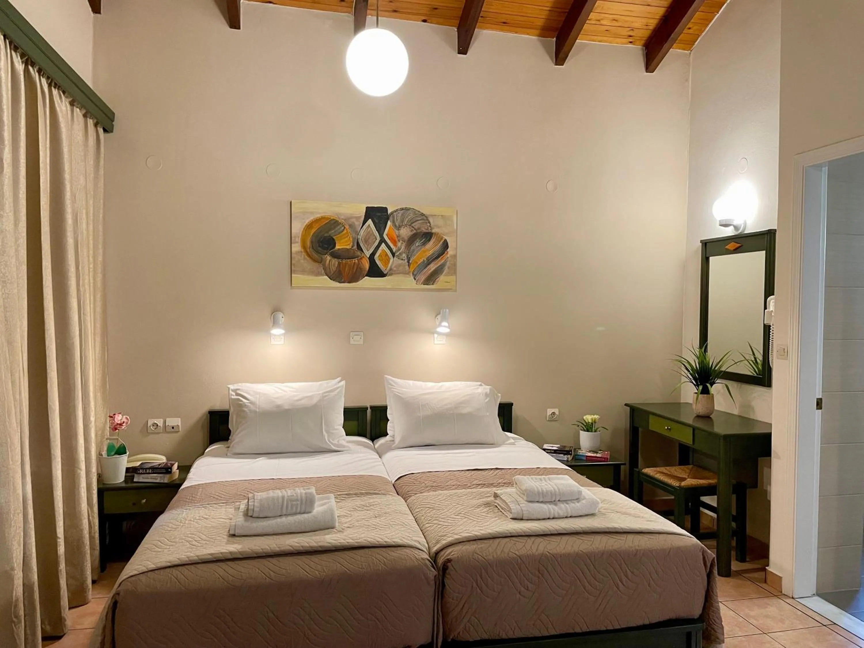 Bed in Theos Holidays Apartments