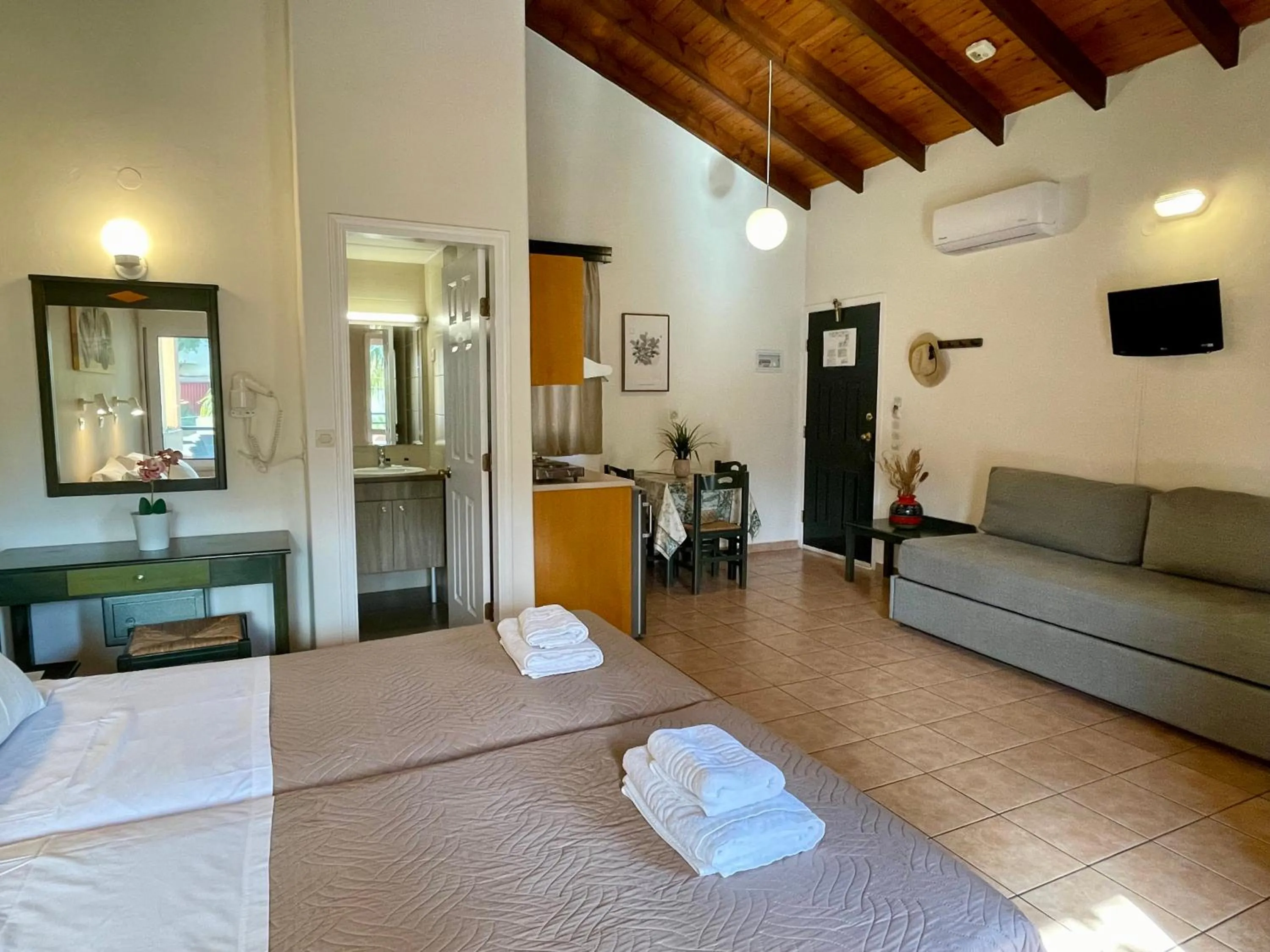 Bed in Theos Holidays Apartments