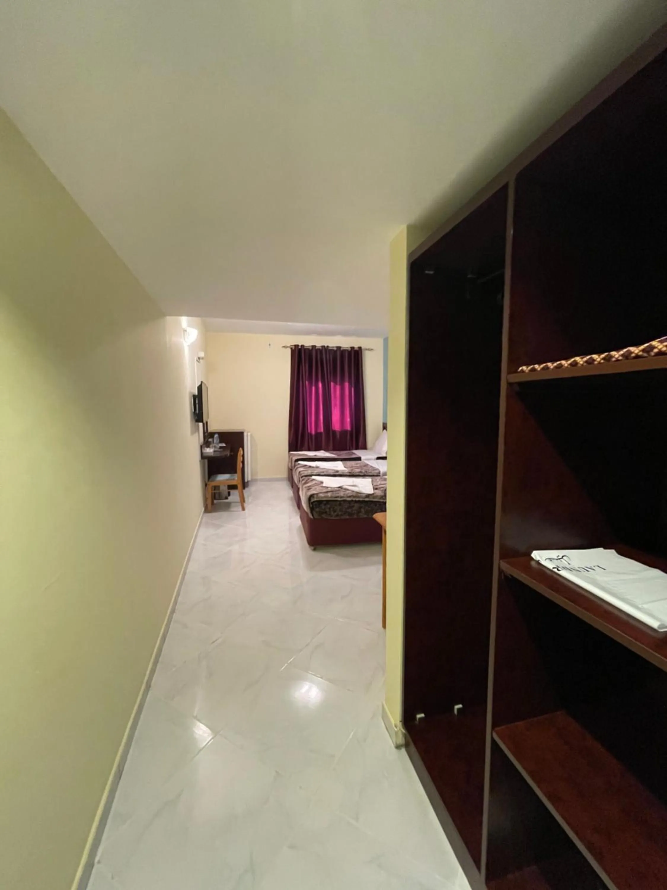 Photo of the whole room, Bed in MOUNT SINA HOTEL By AURA