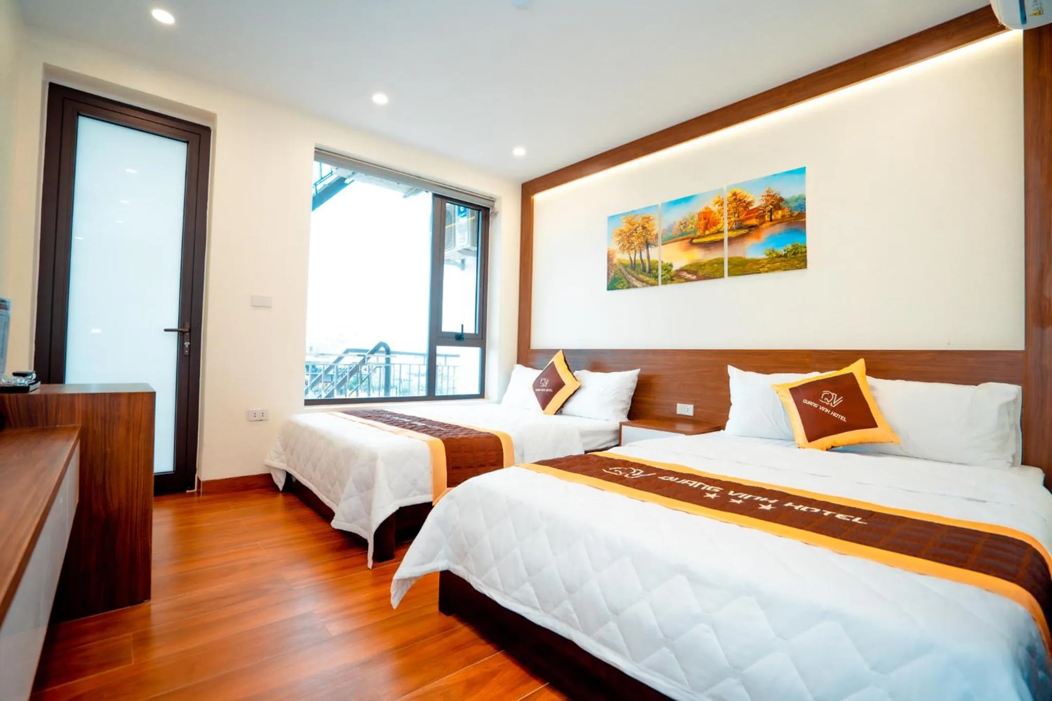 Bed in QUANG VINH HOTEL