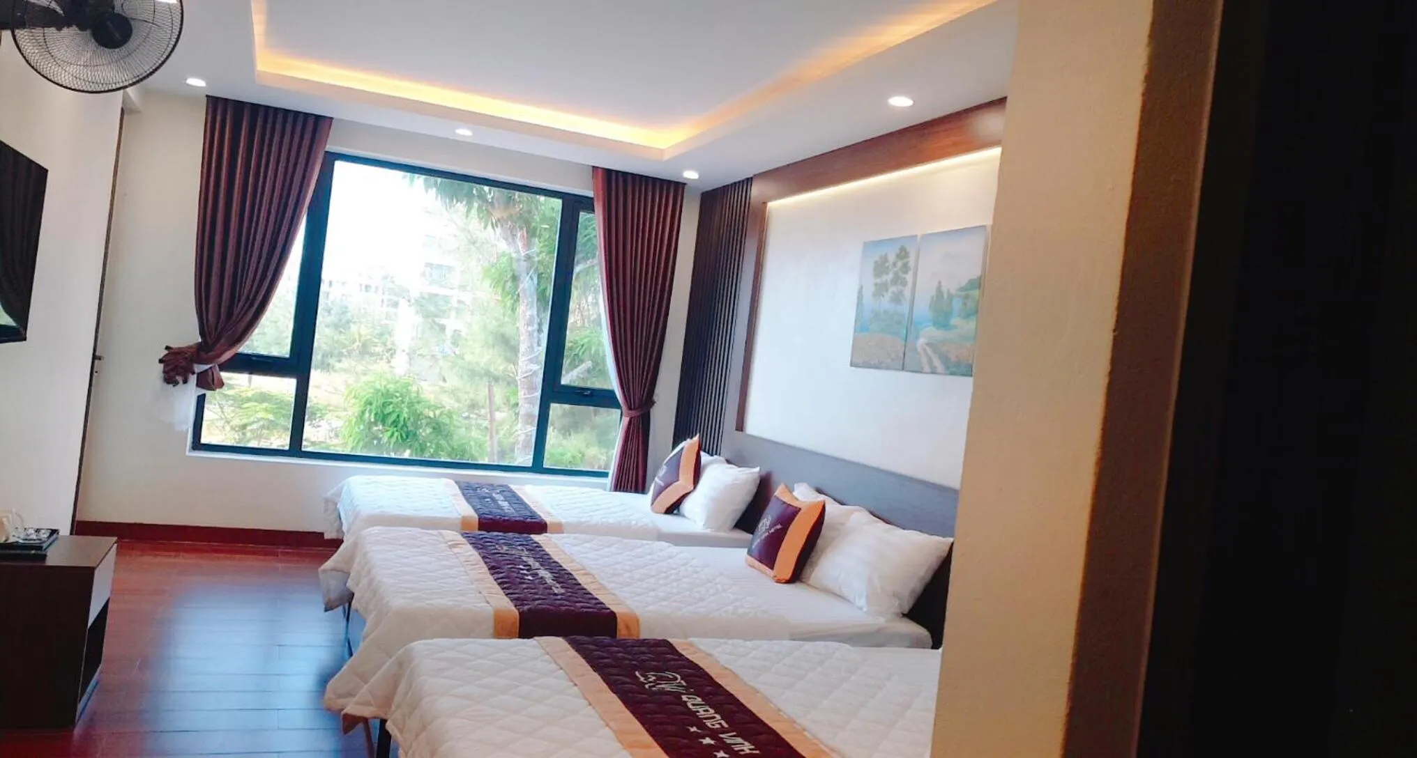 Bed in QUANG VINH HOTEL